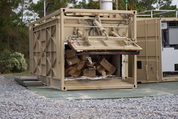 The Air Force Civil Engineer Center recently tested a prototype gasification system at the AFCEC Research and Test Facility on Tyndall Air Force Base, Florida. Engineers are testing the system as an energy efficient and environmentally compliant way to eliminate the use of open pit burning to dispose of municipal solid waste in deployed environments. (U.S. Air Force Photo/Mekka Parish/Released)