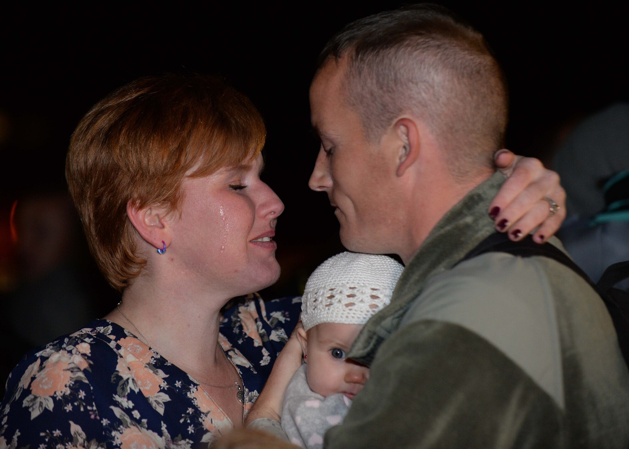 Staff Sgt. Cody, 28th Aircraft Maintenance Squadron NCO in charge of instrument and flight controls, is greeted by his spouse, Shawna, upon returning from a deployment to Southwest Asia at Ellsworth Air Force Base, S.D., Jan. 24, 2015. Following the six month rotation, Cody got the chance to hold his daughter, Zoey, for the first time. (U.S. Air Force photo by Senior Airman Rebecca Imwalle/Released)