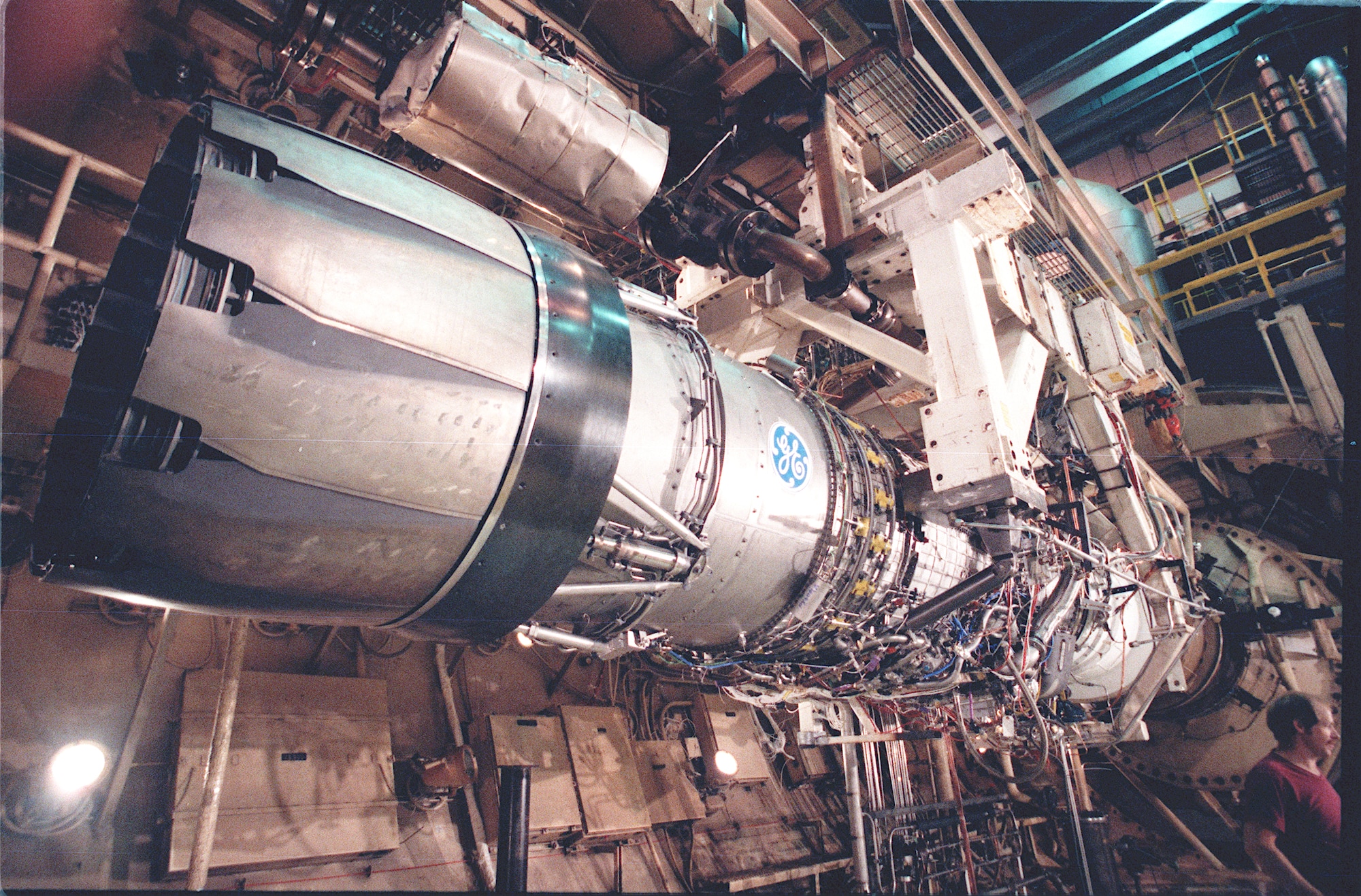 The F110-GE-129 engine is shown in the J-2 engine test cell at AEDC. The engine used improved materials and controls to increase performance up to 20 percent over the F110-GE-100 engine used in the F-16 Fighting Falcon. (AEDC Photo-1987)