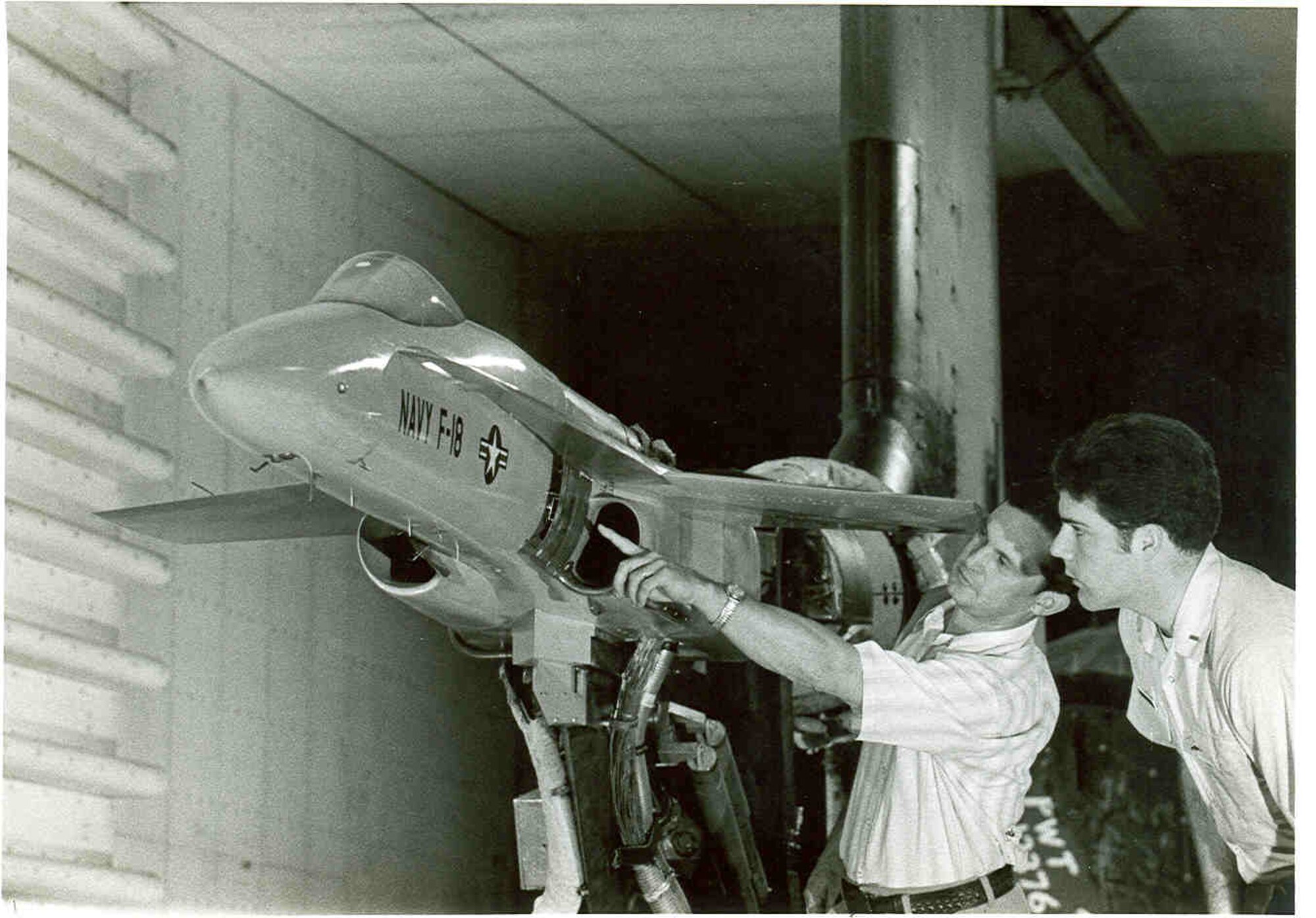 AEDC completed a highly detailed study of stability/performance of inlets that provide air to the engines of the F/A-18 fighter. Simulated flight speeds of 0-1,000 mph over a number of angles of attack and sideslip. (AEDC Photo-1977)