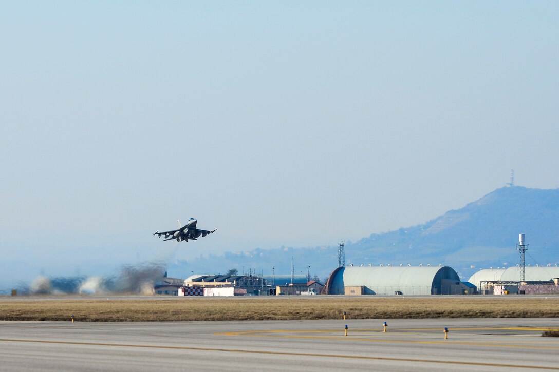 An F-16 Fighting Falcon assigned to the 510th Fighter Squadron, takes off from Aviano Air Base, Italy, Jan. 21, 2016, for Nellis Air Force Base, Nev., to participate in exercise Red Flag 16-1. Red Flag is a realistic combat-training exercise involving the air forces of the United States and its allies. (U.S Air Force photo by Airman 1st Class Cory W. Bush/Released)