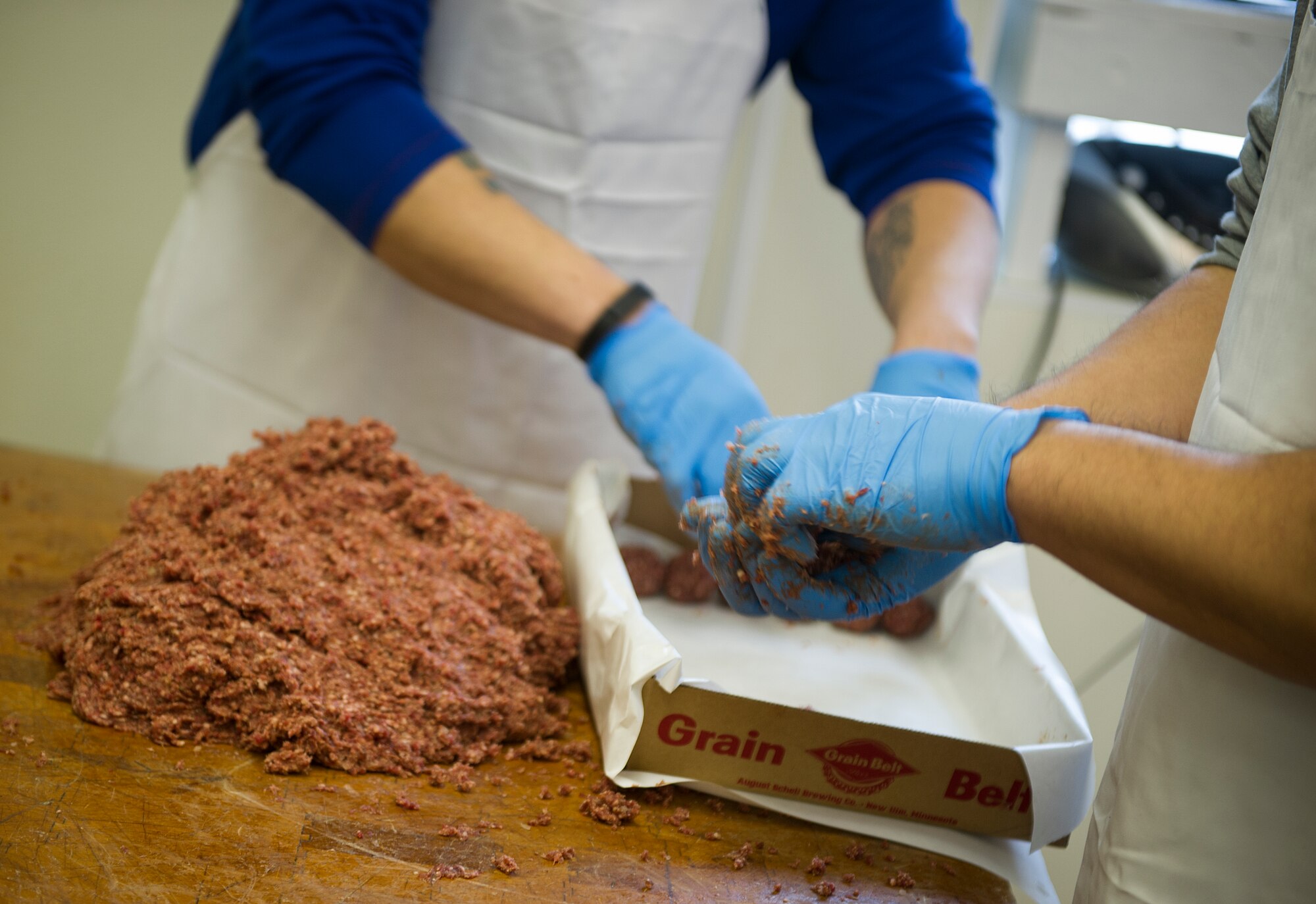 Volunteers prepare venison meatballs at the annual meat cut-up at Bloms’ Locker & Processing in Minot, N.D., Jan. 22, 2015. The meat cut-up event was in preparation for the 51st Annual Sportsmen Feed. (U.S. Air Force photo/Senior Airman Apryl Hall)