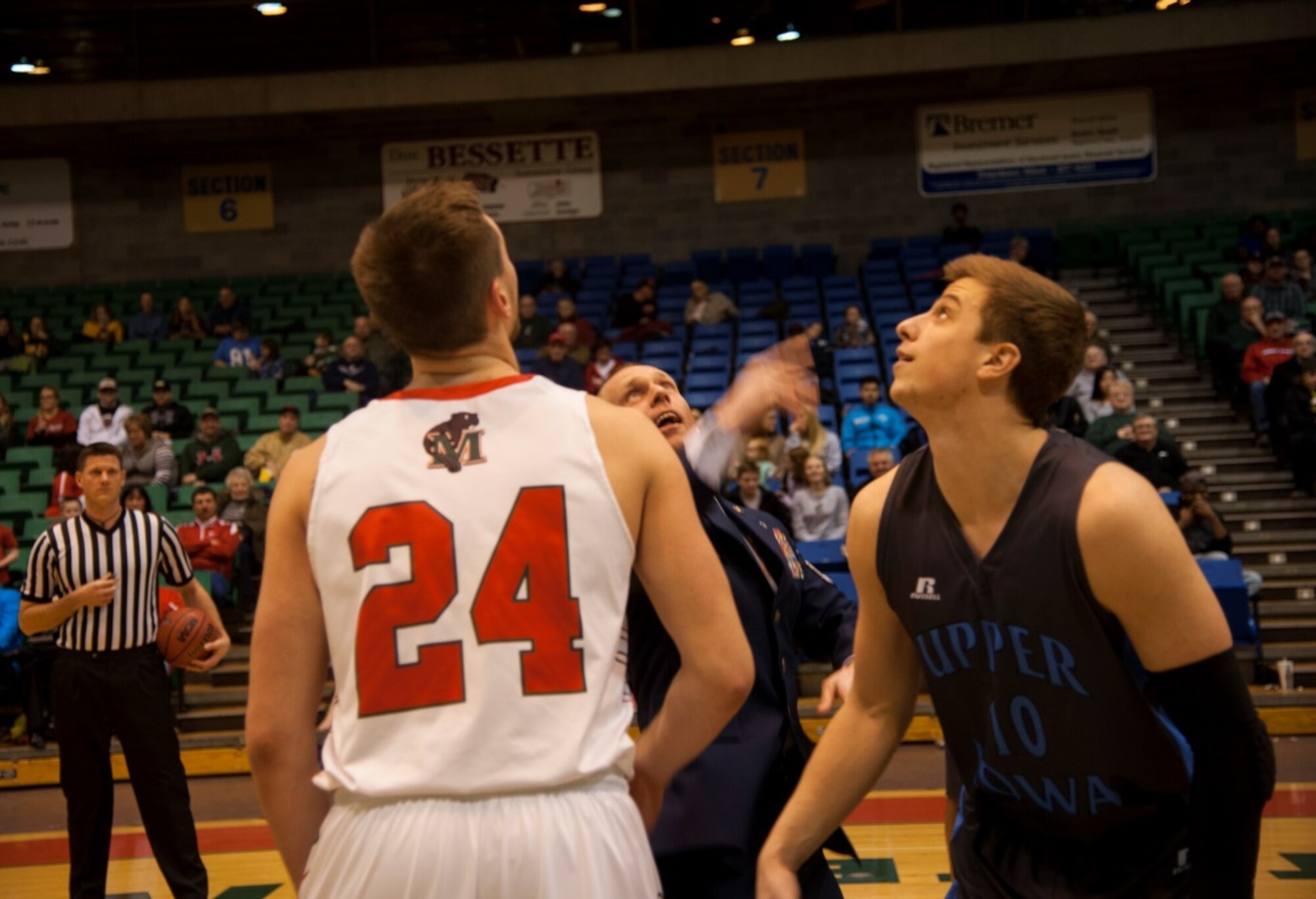 Chief Master Sgt. Geoff Weimer, 5th Bomb Wing command chief, throws the honorary tip off at the Minot State University men’s basketball game Jan. 15, 2016. The tip off was in honor of military appreciation day at MSU, where military members received free admission to the game. (U.S. Air Force photo/Airman 1st Class Christian Sullivan)