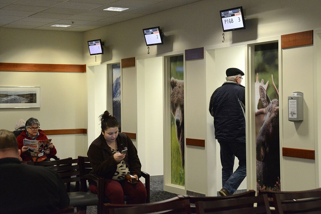 A patient walks into a prescription pickup cubicle at the hospital on Joint Base Elmendorf-Richardson, Alaska, Dec. 23, 2015. The first three pharmacy windows give patients their completed prescriptions while the fourth and fifth house work stations are for filling out and verifying prescription orders. The sixth window is scheduled to be used as an over-the-counter clinic within the next few months. (U.S. Air Force photo by Airman 1st Class Christopher R. Morales)