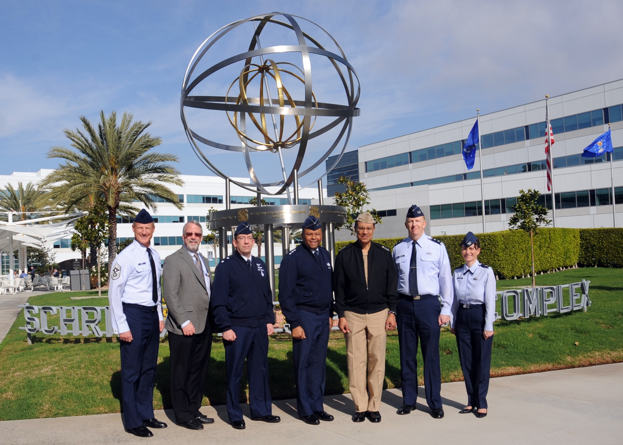 U.S. Navy Adm. Cecil D. Haney (center right), U.S. Strategic Command commander, stands with U.S. Air Force Lt. Gen. Samuel A. Greaves (center), Space and Missile Systems Center commander and Air Force program executive officer for space and other USSTRATCOM and SMC personnel in front of the Armillary (aka the 'Space Motif'), a landmark within SMC's Schriever Space Complex at Los Angeles Air Force Base, El Segundo, Calif., Jan. 20, 2016. SMC, part of the Air Force Space Command, is responsible for the research, development, acquisition on-orbit testing and sustainment of military space and missile systems. Air Force Space Command is a service component of USSTRATCOM. Haney visited SMC to gain a better understanding of the command and its missions. One of nine Department of Defense unified combatant commands, USSTRATCOM has global strategic missions, assigned through the Unified Command Plan, which include strategic deterrence; space operations; cyberspace operations; joint electronic warfare; missile defense; intelligence, surveillance and reconnaissance; combating weapons of mass destruction; and analysis and targeting. (U.S. Air Force photo/Van Ha)