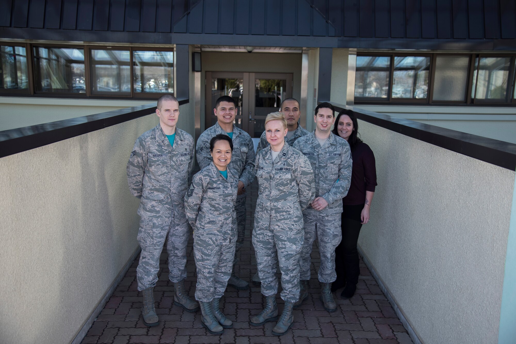 Airmen from the 35th Medical Group pose for a photo at Misawa Air Base, Japan, Jan. 7, 2016. These medical group airmen are in-house representatives who can help answer questions relating to your coverage. For more information on the TRICARE Overseas program, visit http://tricare-overseas.com/Beneficiaries.htm or walk-in or schedule an appointment with the TRICARE team at 226-6000. (U.S. Air Force photo by Senior Airman Brittany A. Chase)
