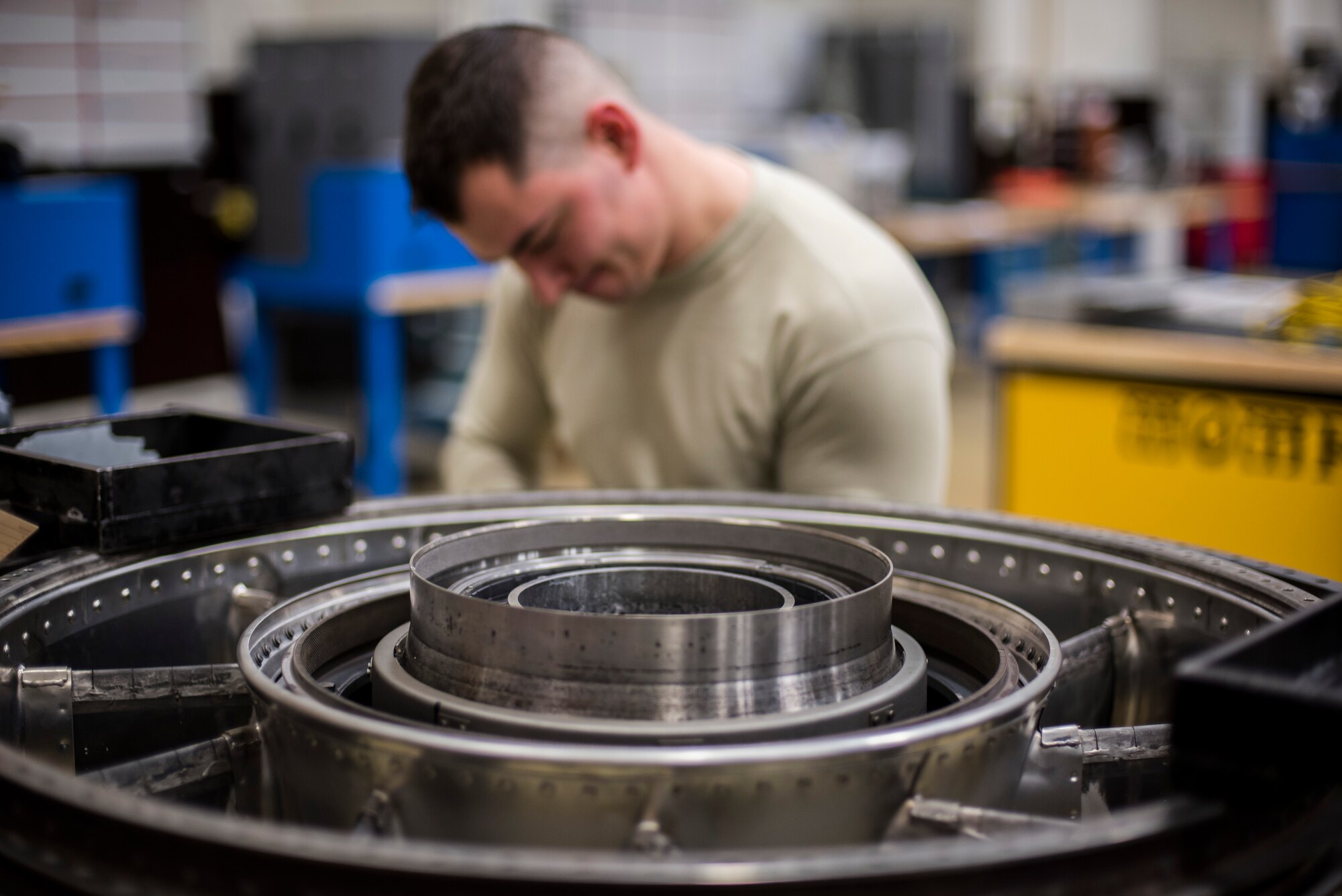 Senior Airman Tyler Susskind, an aerospace propulsion journeyman with the 35th Aircraft Maintenance Squadron, installs a mount link onto a turbine frame at Misawa Air Base, Japan, Jan. 25, 2015. Susskind’s daily job consists of diagnosing engine problems (including the fuel, oil, electrical and engine airflow systems), removing defective components and installing serviceable machinery as well as performing test runs on repaired engines. (U.S. Air Force photo by Senior Airman Brittany A. Chase)