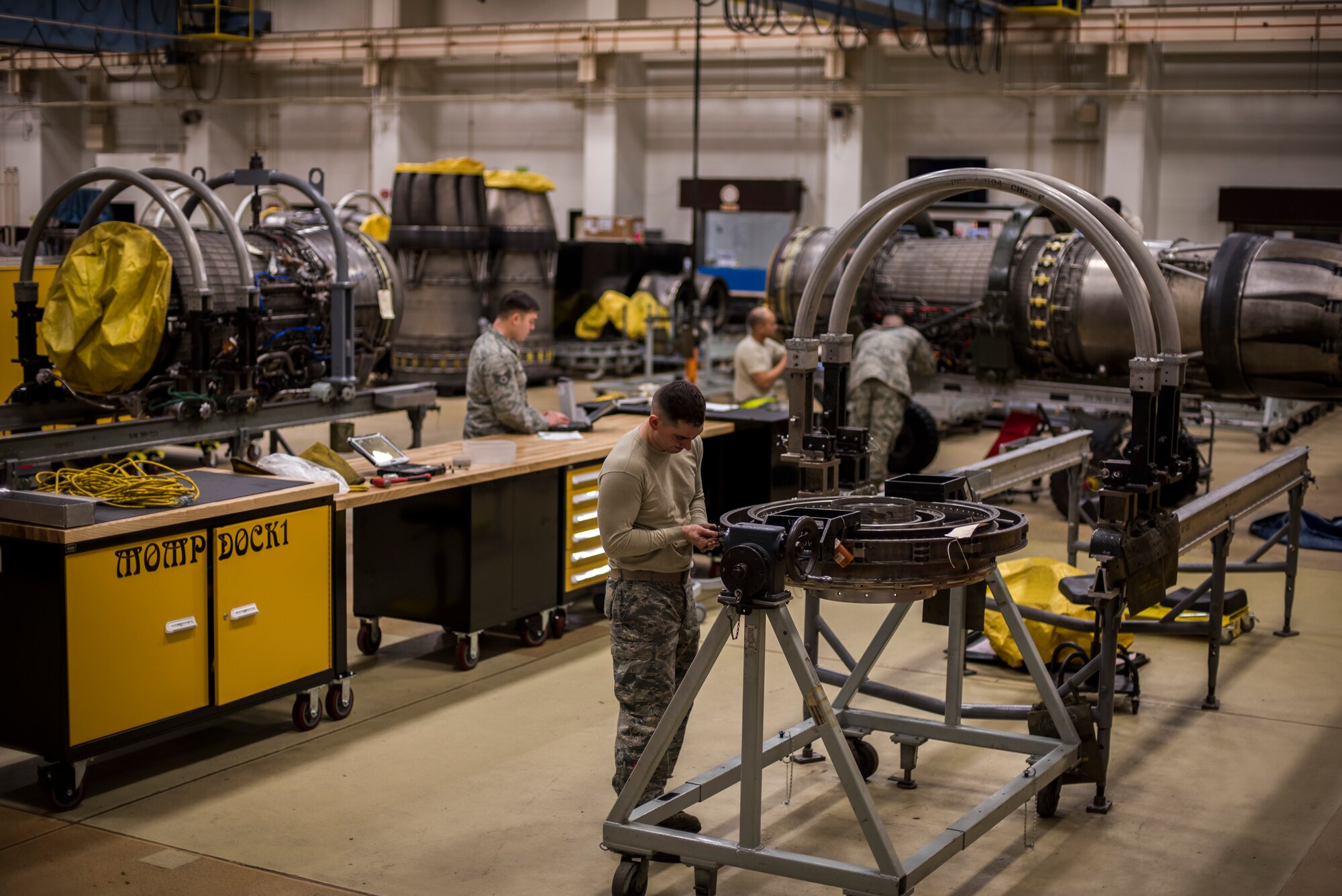 Aerospace propulsions, also known as props, Airmen with the 35th Aircraft Maintenance Squadron, work on F-16 Fight Falcon jet engines at Misawa Air Base, Japan, Jan. 25, 2015. The daily job of a props Airman can consist of diagnosing engine problems (including the fuel, oil, electrical and engine airflow systems), removing defective components and installing serviceable machinery as well as performing test runs on repaired engines. (U.S. Air Force photo by Senior Airman Brittany A. Chase)