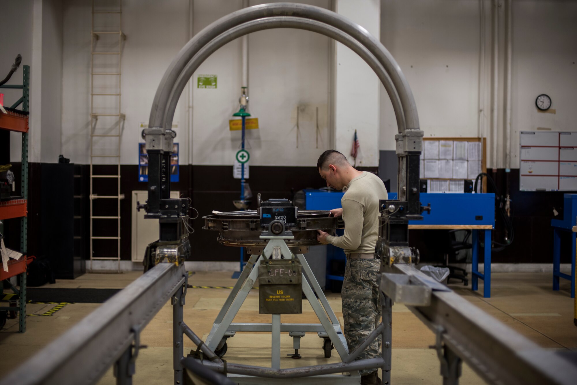 Senior Airman Tyler Susskind, an aerospace propulsion journeyman with the 35th Aircraft Maintenance Squadron, installs a mount link onto a turbine frame at Misawa Air Base, Japan, Jan. 25, 2015. At any given time Susskind can have up to two engines to work on. (U.S. Air Force photo by Senior Airman Brittany A. Chase)