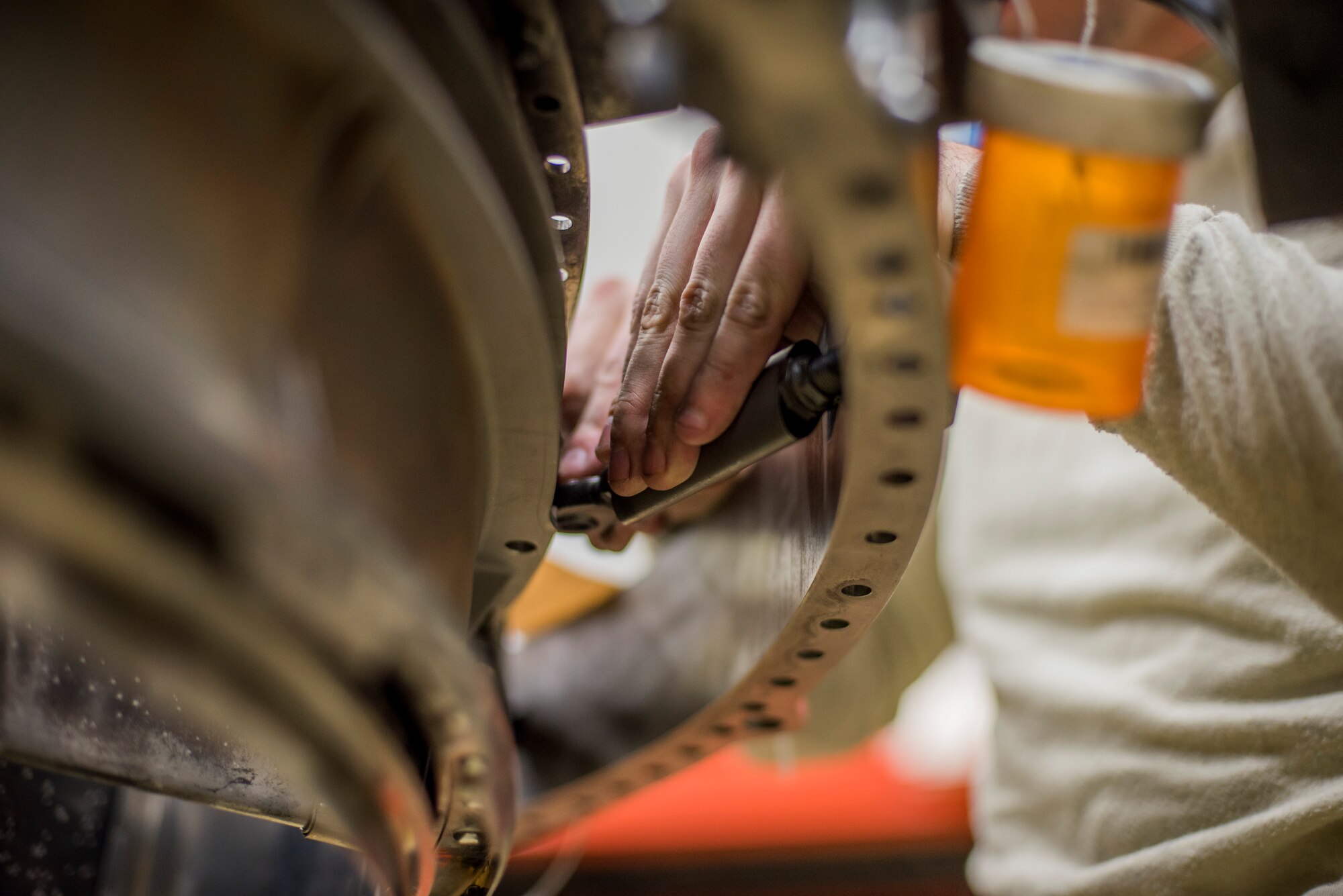 Senior Airman Tyler Susskind, an aerospace propulsion journeyman with the 35th Aircraft Maintenance Squadron, installs a mount link onto a turbine frame at Misawa Air Base, Japan, Jan. 25, 2015. As an aerospace propulsion specialist, Susskind ensures engines are in first-rate operational condition. (U.S. Air Force photo by Senior Airman Brittany A. Chase)