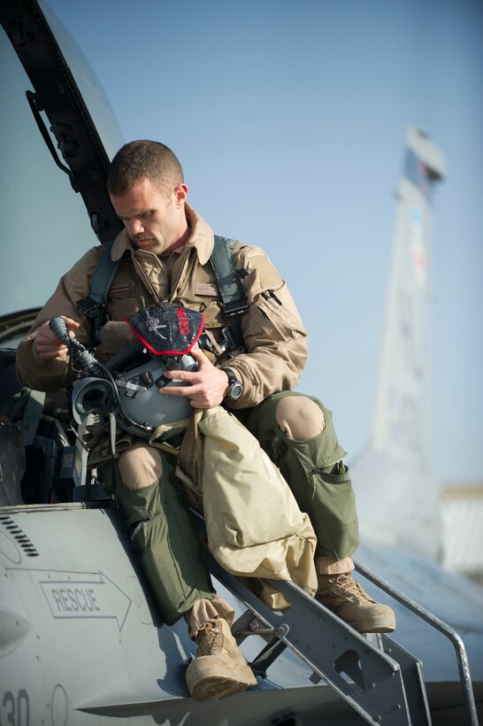 Air Force Maj. Chris Carden checks his equipment at Bagram Airfield, Afghanistan, before a combat sortie on Jan. 17, 2016. Carden is an F-16 pilot assigned to the 421st Expeditionary Fighter Squadron. U.S. Air Force photo by Capt. Bryan Bouchard