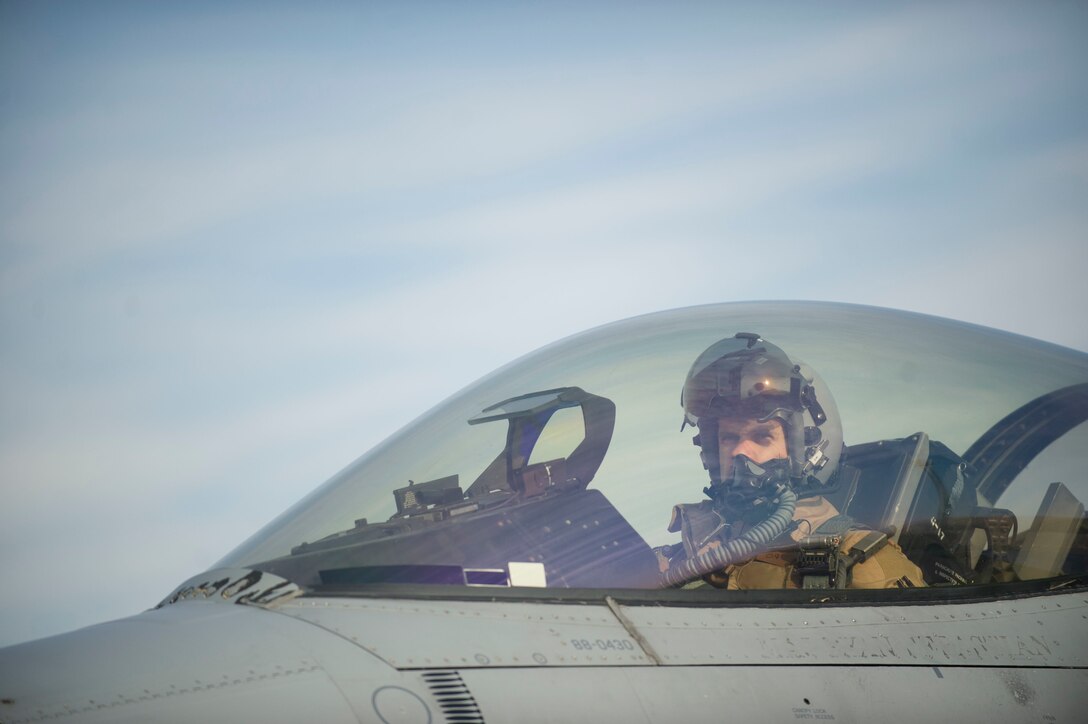 Air Force Maj. Chris Carden prepares to depart for a combat sortie in an F-16 Fighting Falcon aircraft at Bagram Airfield, Afghanistan, Jan. 17, 2016. Carden is a pilot assigned to the 421st Expeditionary Fighter Squadron. U.S. Air Force photo by Capt. Bryan Bouchard