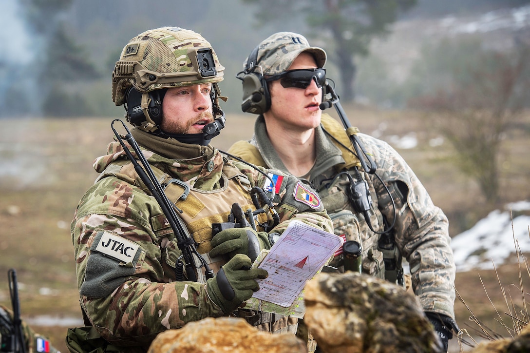 Slovenian Army Cpl. Anje Komac trains with U.S. Air Force Cpt. Skylar Jackson a Joint Terminal Attack Controller with the Bullseye Observer Coach Trainer Team at the Hohenfels training area, Germany, during exercise Allied Spirit IV, Jan. 25, 2016. U.S. Army photo by Sgt. 1st Class Caleb Barrieau