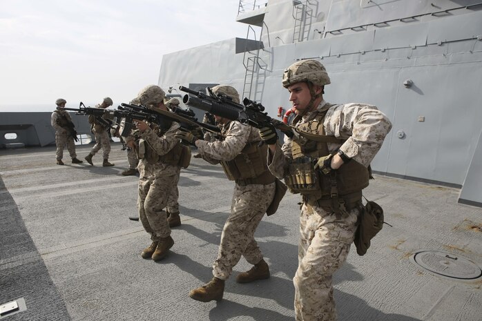 U.S. Marines with Fox Company, Battalion Landing Team 2/6, 26th Marine Expeditionary Unit (26th MEU), conduct speed reload drills aboard the amphibious transport dock ship USS Arlington (LPD 24), Jan 22, 2016. The 26th MEU is embarked with the Kearsarge Amphibious Ready Group and is deployed to maintain regional security in the U.S. 5th Fleet area of operations. (U.S. Marine Corps photo by Cpl. Jeraco Jenkins/26th MEU Combat Camera/Released)