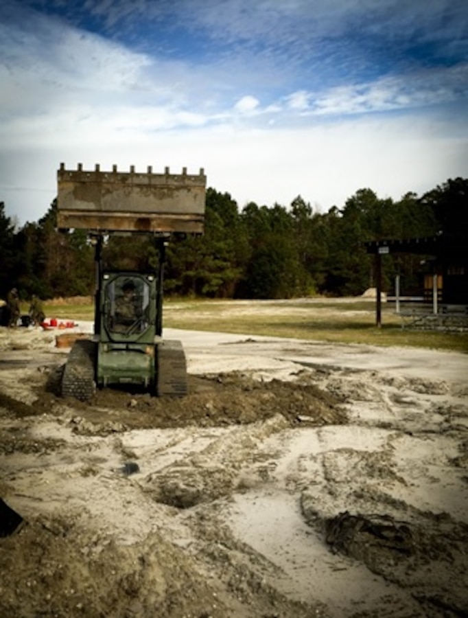 On January 20, 2016 Second Lieutenant Erik Henegar, a Marine with Combat Engineer Officer course 3-16 (CEO 3-16); practices operating a multi-terrain loader at the airfield damage repair site in Courthouse Bay, Camp Lejeune, N.C. The multi-terrain loader comes with the first container of the airfield damage repair kit and can be used as a broom, compactor, hammer, or with its multi-purpose bucket.


