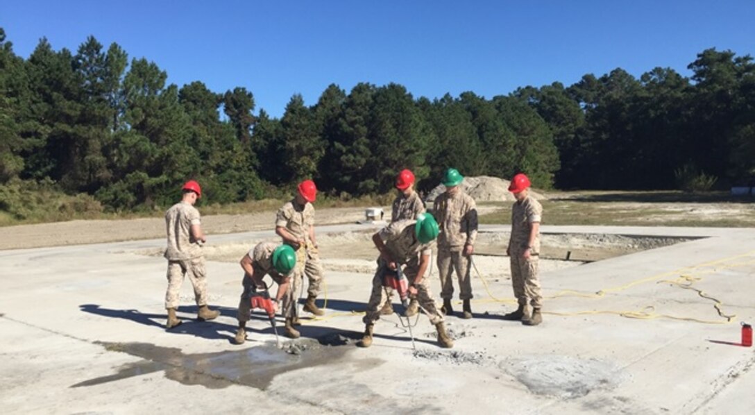 On October, 20, 2015 Marines attached to Combat Engineer Officer course 1-16 (CEO 1-16) conduct practical application on spawl and crater repair during their airfield damage repair class using rock and hammer drills from the Airfield Damage Repair kit at Courthouse Bay, Camp Lejeune, N.C.  
