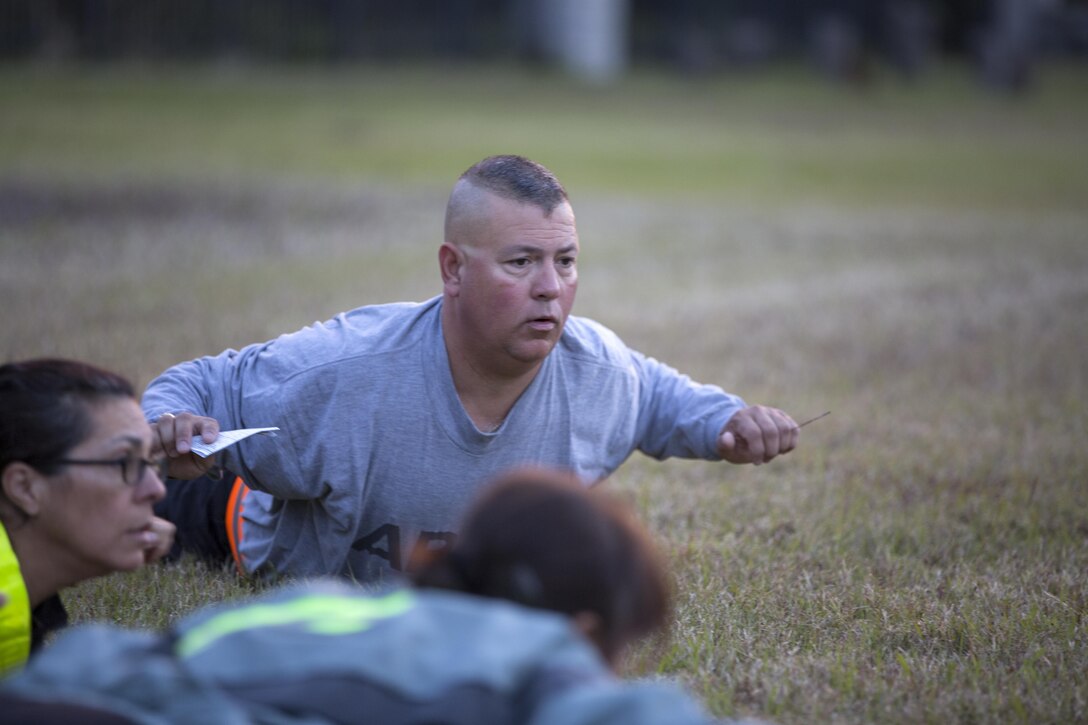 Army Reserve Medical Command Soldiers participate in physical readiness training (PRT) on a field near the C.W. Bill Young Armed Forces Reserve Center in Pinellas Park, Fla., Jan. 22, 2016. PRT provides a balanced training program that prepares Soldiers for successful task performance and provides linkage to other training conducted during the duty day. (U.S. Army photo by Spc. Tracy McKithern/Released)
