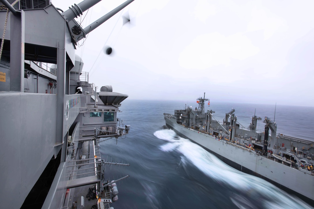 The USS John C. Stennis sails alongside USNS Rainier for a replenishment at sea in the Pacific Ocean, Jan. 18, 2016. The Stennis was operating in the U.S. 3rd Fleet area of operations for a regularly scheduled Western Pacific deployment. U.S. Navy photo by Petty Officer 3rd Class Kenneth Rodriguez Santiago