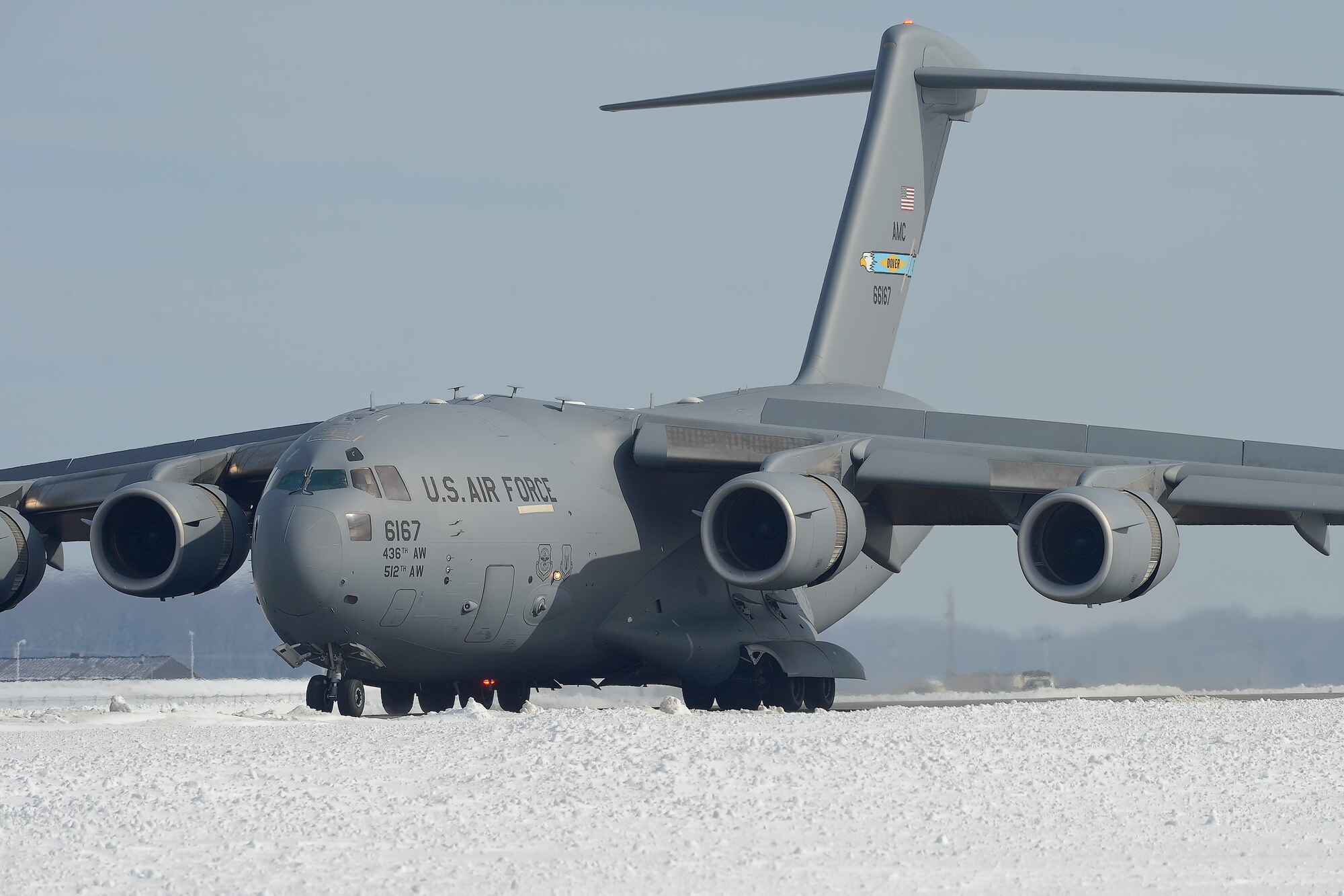 A C-17A Globemaster III of the 436th Airlift Wing decelerates on the runway using its thrust-reversers after landing Jan. 25, 2016, at Dover Air Force Base, Del. The airfield is covered in 22 inches of accumulated snow from Winter Storm Jonas. (U.S. Air Force photo/Greg L. Davis)