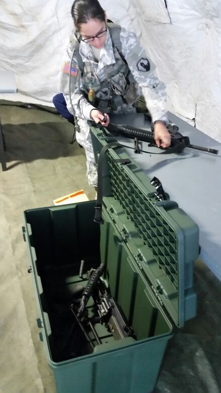 Sgt. Gabriela Echevarria, 276th Maintenance Company from Canovanas, Puerto Rico, assembles an M16A4 rifle during the second day of the 77th CSSB Best Warrior Competition held 22-24 January at Ramey Base, Aguadilla, Puerto Rico.