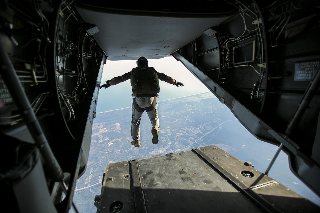 A Marine jumps out of the back of an MV-22B Osprey at 13,000 feet over Marine Corps Air Station New River, N.C., Jan. 21, 2016. The Marine is assigned to U.S. Marine Corps Forces, Special Operations Command. The unit conducted high-altitude, low-opening jumps, which occur around 13,000 feet. U.S. Marine Corps photo by Lance Cpl. Luke Hoogendam