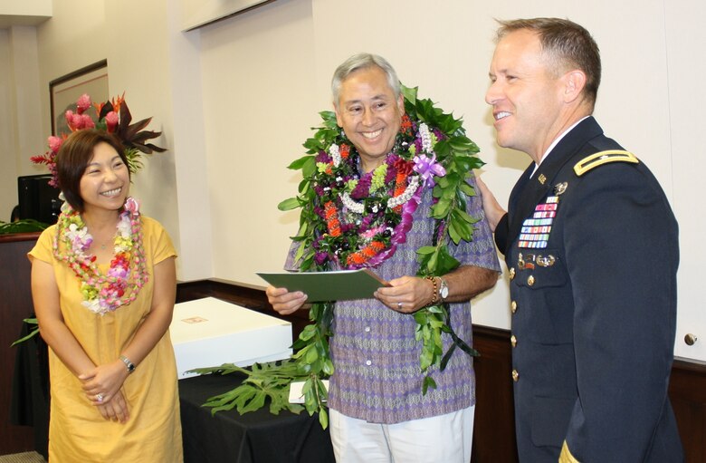 USACE Pacific Ocean Division Commanding General, Brig. Gen. Jeffrey Milhorn, congratulates Gary Kitkowski and his wife, Eri, on Kitkowski’s appointment to the Senior Executive Service and selection for the position of Director of Regional Business for POD. Friends, co-workers, current and former POD leaders gathered at the POD headquarters at Fort Shafter, Hawaii Jan. 21 to honor the new SES leader. 