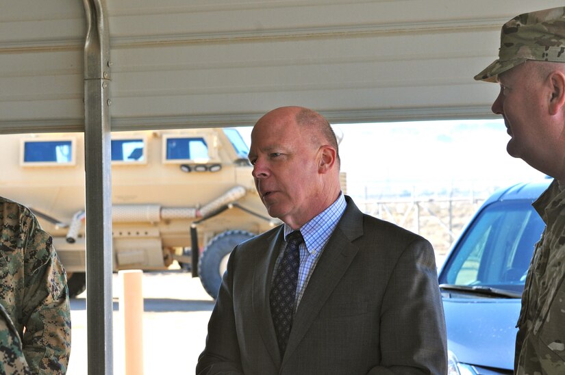 James Balocki (center), command executive officer, Office of the Chief of Army Reserve, listens, as he is welcomed to Equipment Concentration Site 171 of the 63rd Regional Support Command, Yermo, Calif., Jan. 25. Standing to his right is Maj. Gen. Nickolas Tooliatos, commanding general, 63rd Regional Support Command, who accompanied Balocki on his visit to ECS 171.