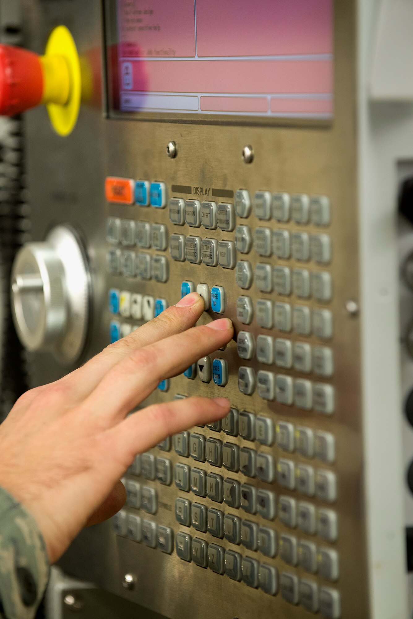 U.S. Air Force Staff Sgt. Keith Holland, 23d Equipment Maintenance Squadron aircraft metals technology craftsman, operates a computer numeric control milling machine, Jan. 25, 2016, at Moody Air Force Base, Ga. The machine uses computer-aided design software to create tools and parts to support multiple base agencies. (U.S. Air Force photo by Airman Daniel Snider/Released)
