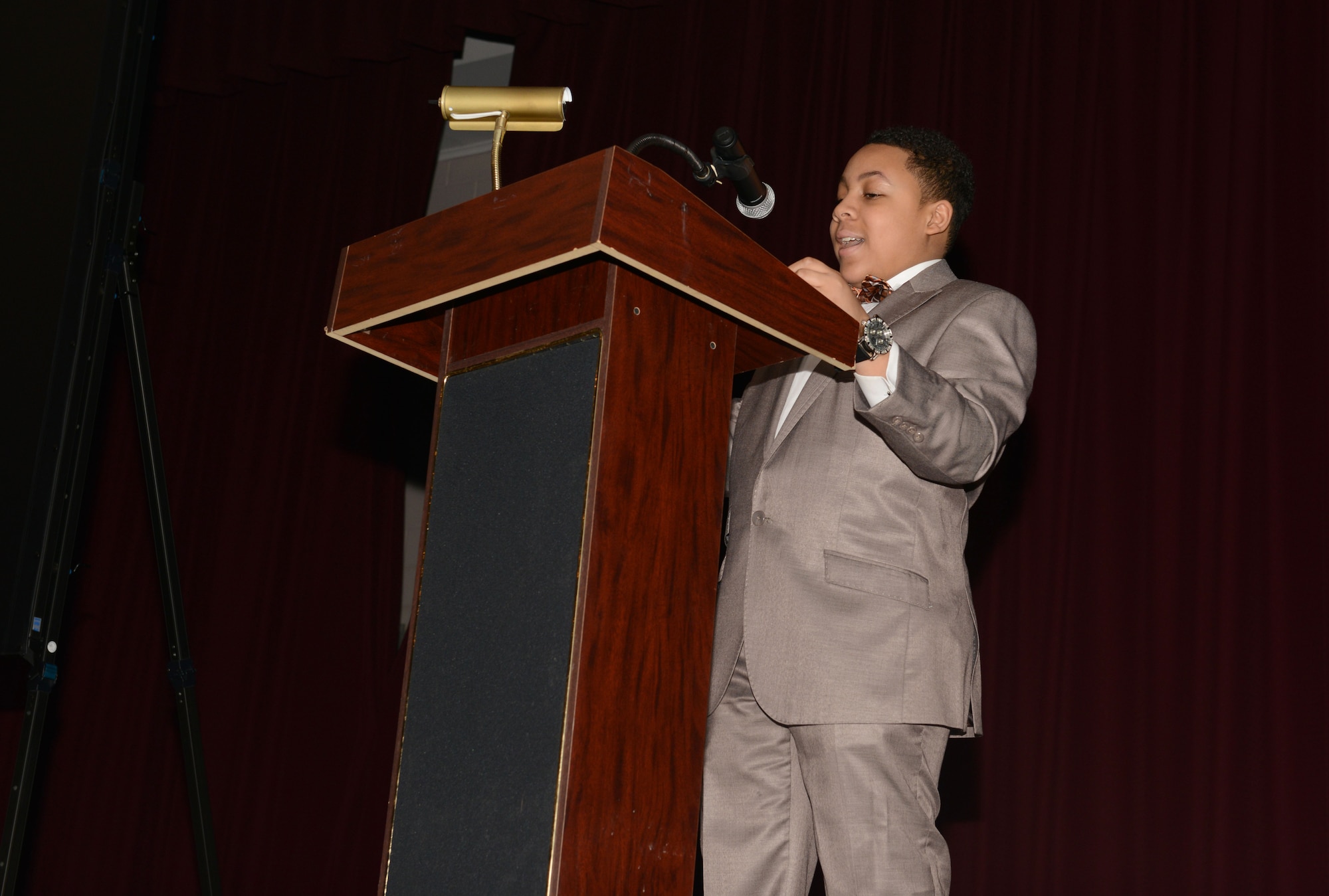 Donovan Summers, a 12-year-old motivational speaker, gives a speech at Shaw Air Force Base, S.C., Jan. 21, 2016. Mark Myers, a local business owner, also spoke during the Martin Luther King Jr. commemoration event. (U.S. Air Force photo by Airman 1st Class Destinee Dougherty)