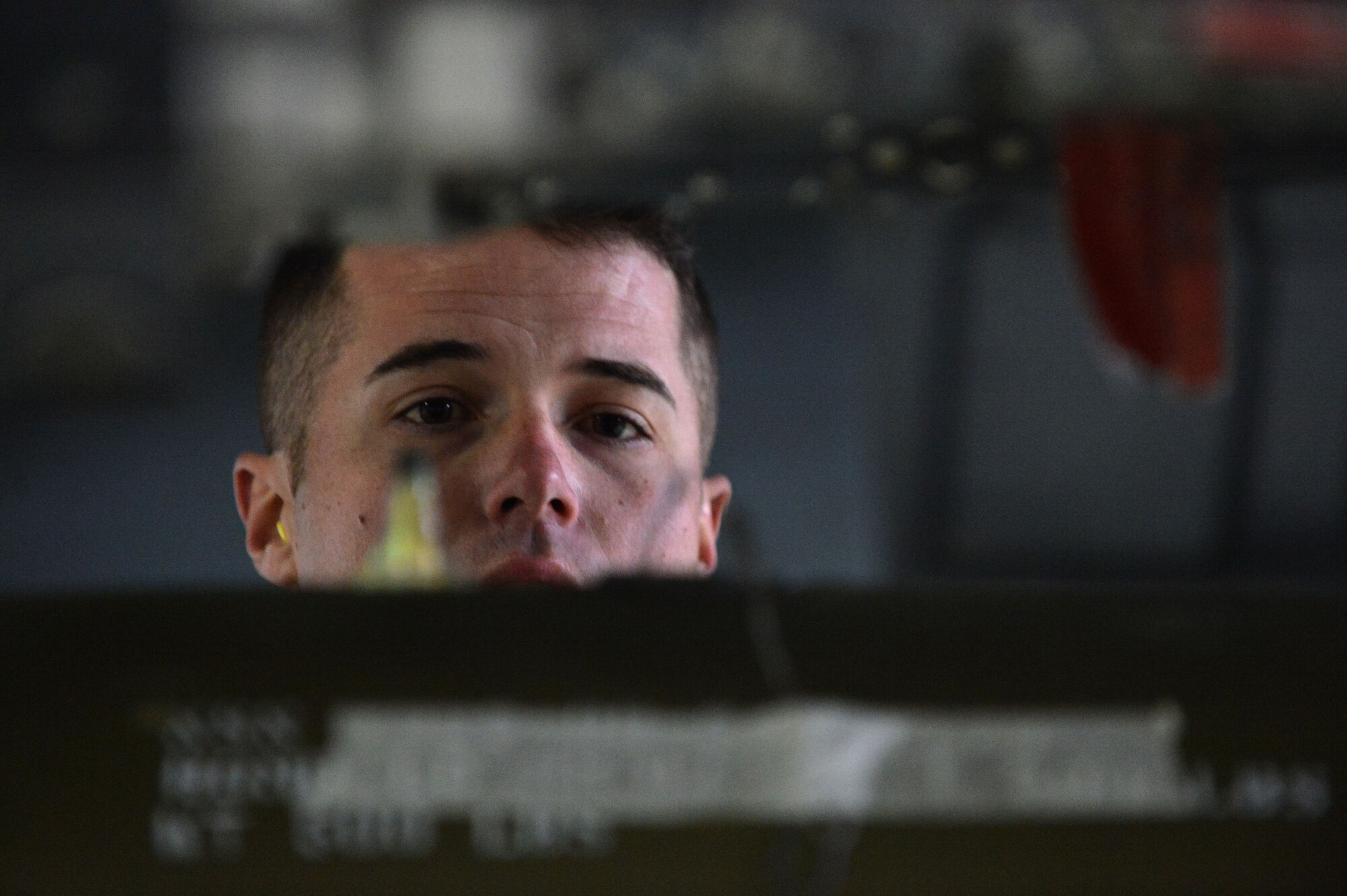 U.S. Air Force Staff Sgt. Benjamin Cooper, 20th Equipment Maintenance Squadron load crew team leader, inspects the loading of munitions onto an F-16CM Fighting Falcon during a Load Crew of the Year competition at Shaw Air Force Base, S.C., Jan. 22, 2016. Cooper and his team worked together to ensure three munitions were loaded as safely and as quickly as possible. (U.S. Air Force photo by Senior Airman Michael Cossaboom)