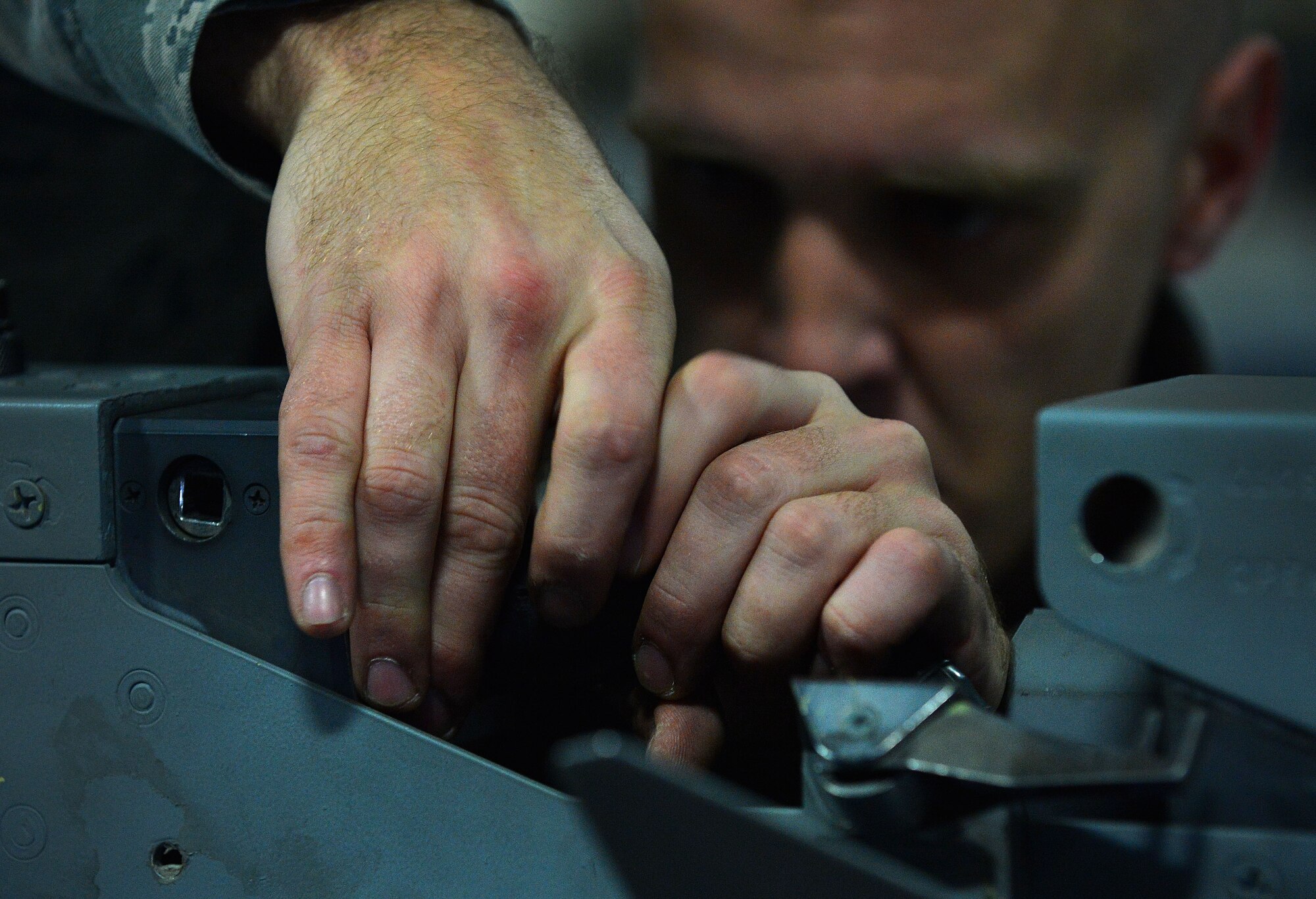 U.S. Air Force Senior Airman Anthony Howell, 20th Equipment Maintenance Squadron load crew member, secures munitions loaded onto an F-16CM Fighting Falcon during a Load Crew of the Year competition at Shaw Air Force Base, S.C., Jan. 22, 2016. The competition pits load crew teams against each other, testing their teamwork and their unit’s comradery. (U.S. Air Force photo by Senior Airman Michael Cossaboom)