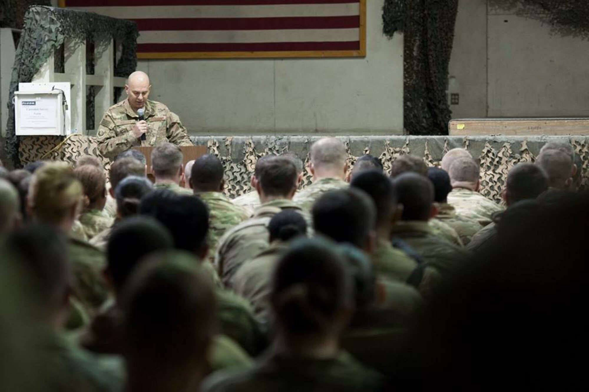 Service members from several units at Bagram Airfield, Afghanistan pay their respects during a fallen comrade ceremony held in honor of six Airmen Dec. 23, 2015. The six Airmen lost their lives in an improvised explosive attack near Bagram Dec. 21, 2015. (U.S. Air Force photo by Tech. Sgt. Robert Cloys)