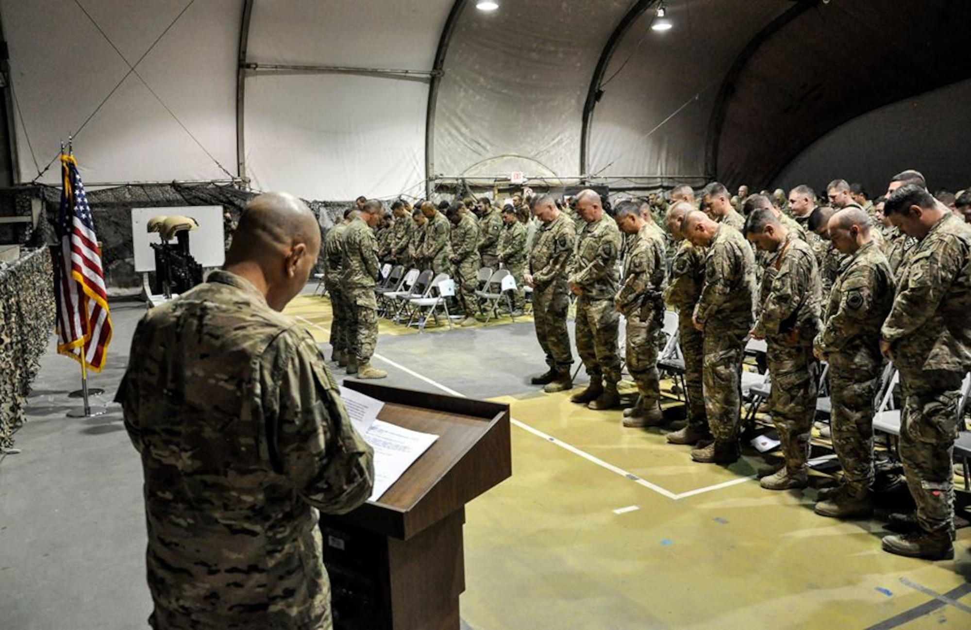 Service members from several units at Bagram Airfield, Afghanistan pay their respects during a fallen comrade ceremony held in honor of six Airmen Dec. 23, 2015. The six Airmen lost their lives in an improvised explosive attack near Bagram Dec. 21, 2015. (U.S. Air Force photo by Tech. Sgt. Nicholas Rau)