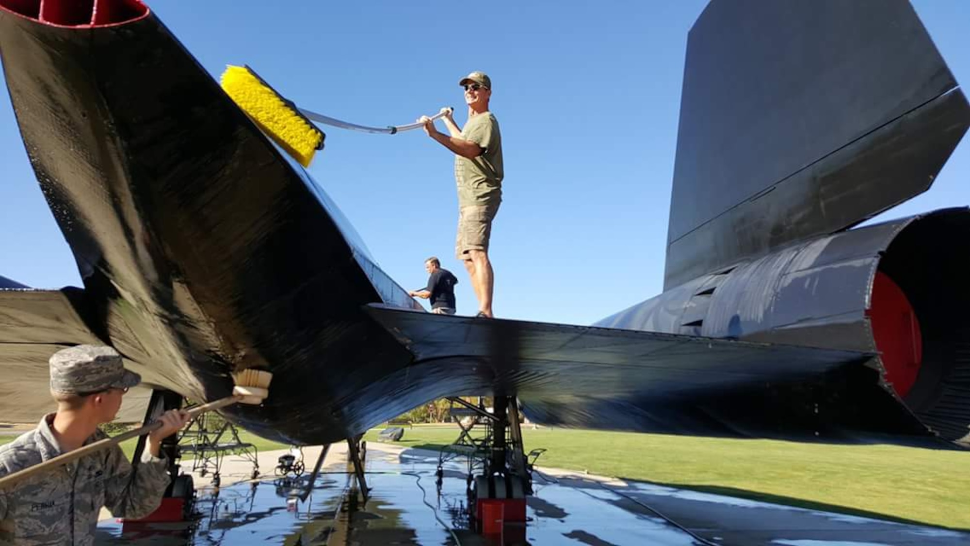 Members of Team Beale and Blackbird Maintainers clean the SR-71 static display at Beale Air Force Base, California. (Courtesy photo) 