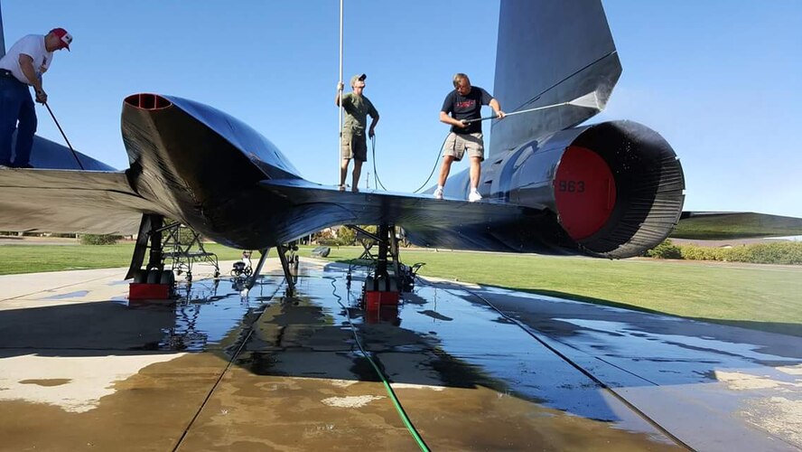 Blackbird Maintainers clean the SR-71 static display at Beale Air Force Base, California. (Courtesy photo)    