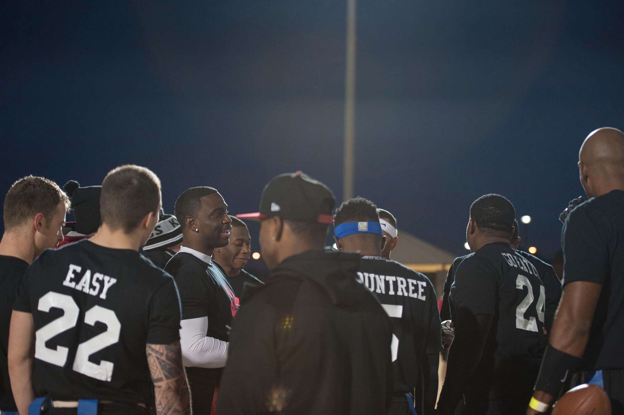 Tech. Sgt. Terrance Kelly, 757th Aircraft Maintenance Squadron, addresses his teammates after beating the Fort Irwin Sidewinders at Tropical Breeze Park in North Las Vegas on Jan. 16, 2016. The Nellis Air Force Base flag football team won three games on Saturday, earning them the number two seed. (U.S. Air Force photo by Senior Airman Mikaley Kline)