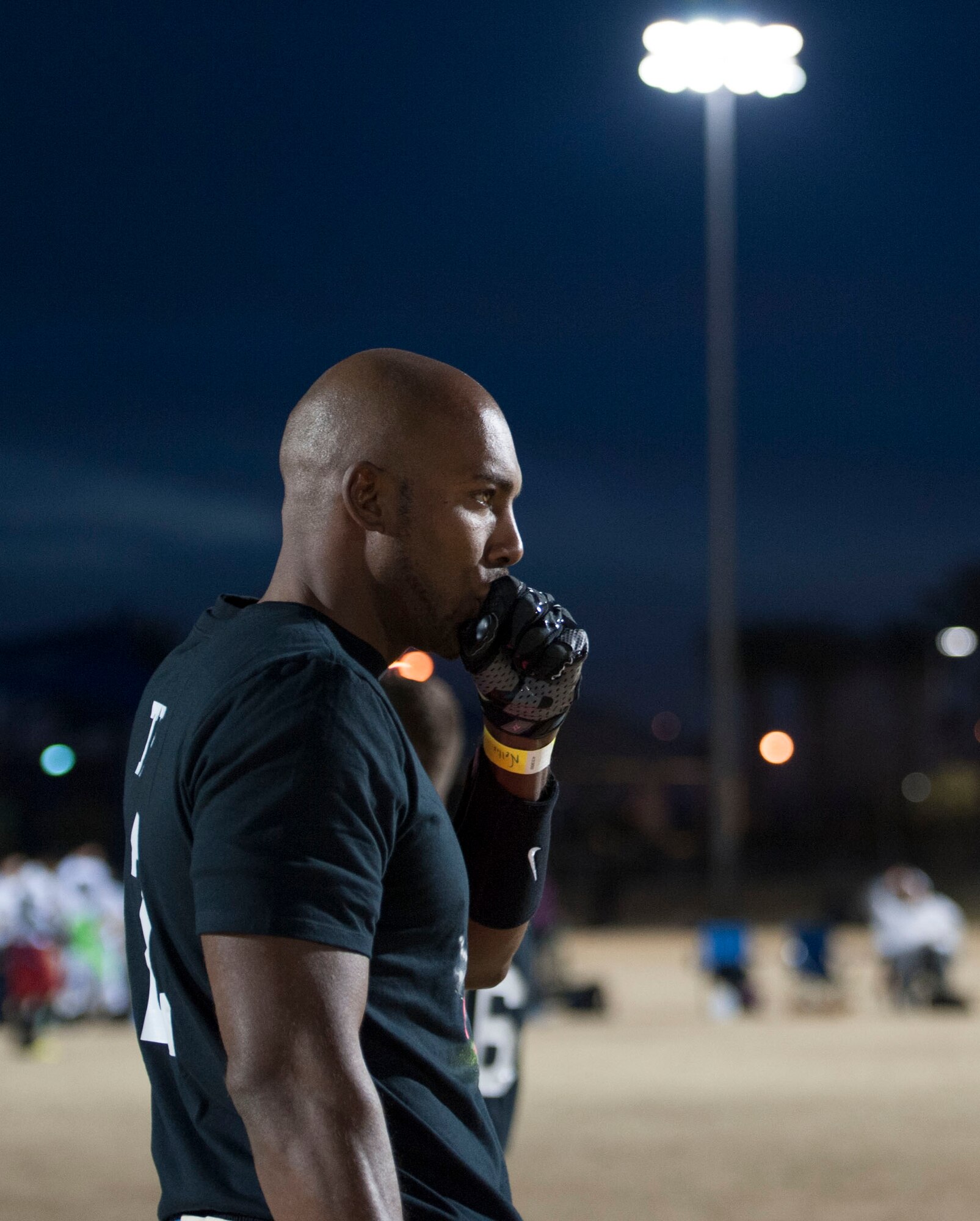 Tech. Sgt. Terrance Brown, 823rd Maintenance Squadron, warms up his hands after winning a flag football game at Tropical Breeze Park in North Las Vegas on Jan. 16, 2016. The Nellis Air Force Base flag football team vied for a winning spot amongst the other 14 teams in their division. (U.S. Air Force photo by Senior Airman Mikaley Kline)
