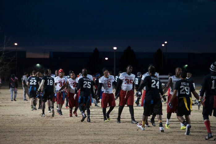 The Nellis Air Force Base flag football team performs post game handshakes with the Fort Irwin Sidewinders after winning a flag football game at Tropical Breeze Park in North Las Vegas on Jan. 16, 2016. The Nellis AFB team won the game with a score of 21 to 14. (U.S. Air Force photo by Senior Airman Mikaley Kline)