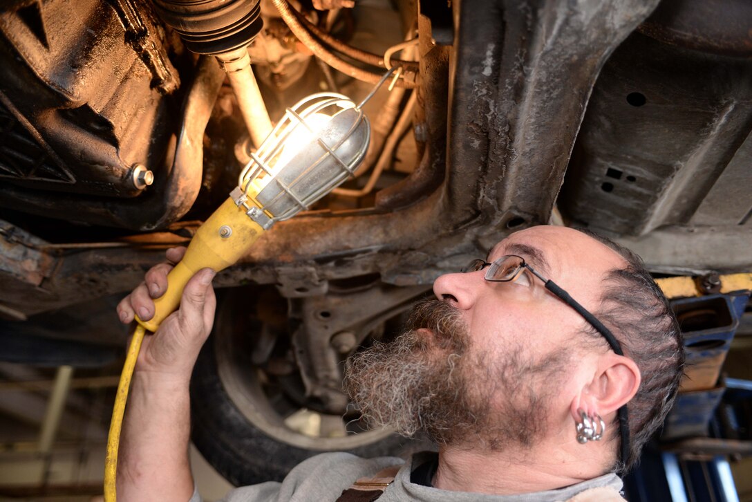 Alspaw Michael, Department of Indian Health Service driver and maintenance assistance, checks his vehicle’s block-heater at the Auto Hobby Center at Ellsworth Air Force Base, S.D., Jan. 19, 2016. The shop allows anyone with base access to use one of their maintenance bays to perform personal vehicle maintenance and is open Monday through Thursday from 8:30 a.m. to 4:30 p.m.;  Fridays from 8:30 a.m. to 6 p.m.; and Saturdays from 8:30 a.m. to 2 p.m. For more information on services provided by the shop, call (605) 385-2900. (U.S Air Force photo by Airman Sadie Colbert/Released)