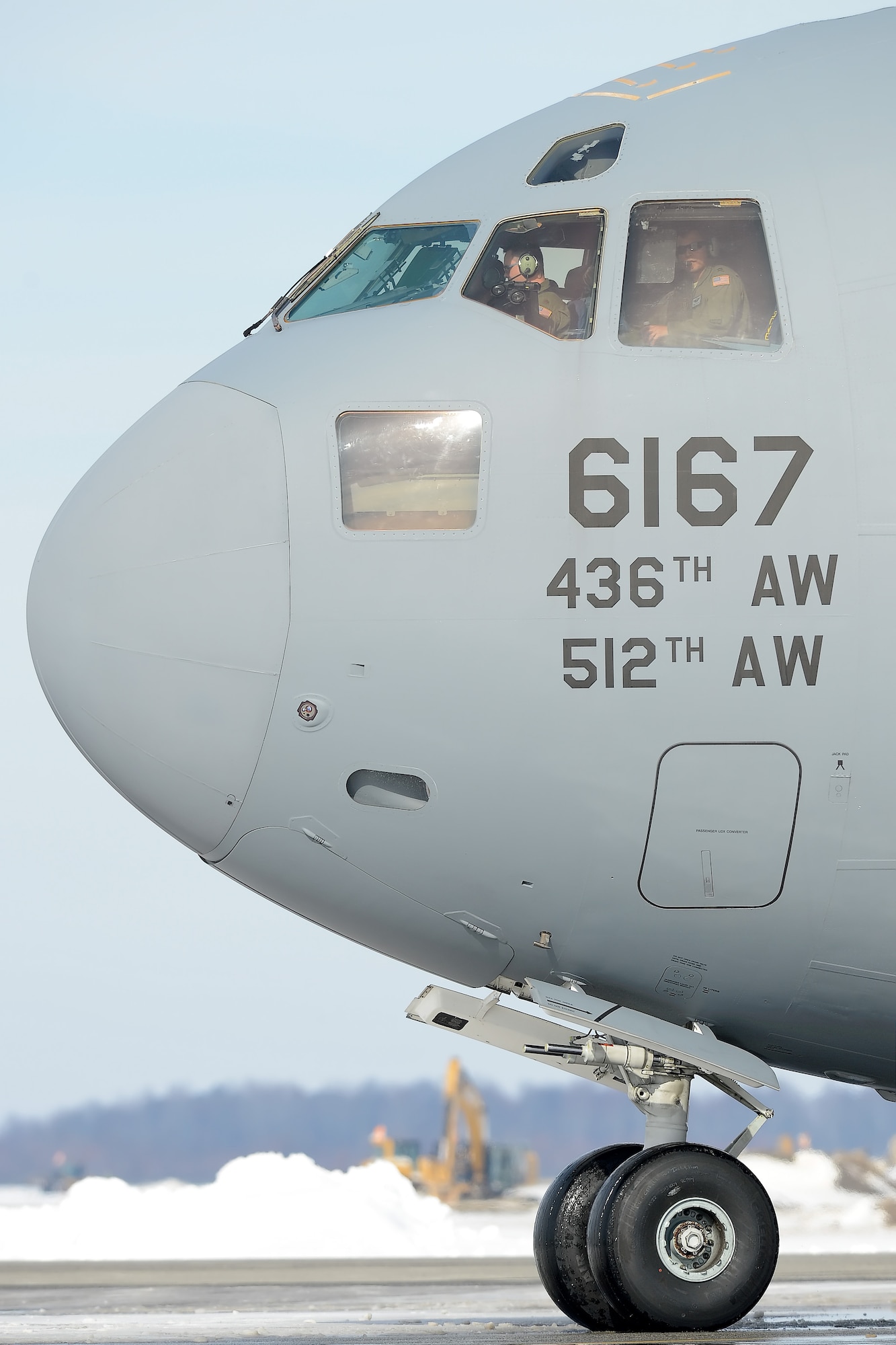 A C-17A Globemaster III of the 436th Airlift Wing taxis to park at the end of a mission Jan. 25, 2016, at Dover Air Force Base, Del. The base had 22 inches of snow dumped on it by Winter Storm Jonas during the previous 48 hours, but the runway was quickly returned to operational status to allow aircraft departures and recoveries. (U.S. Air Force photo/Greg L. Davis)
