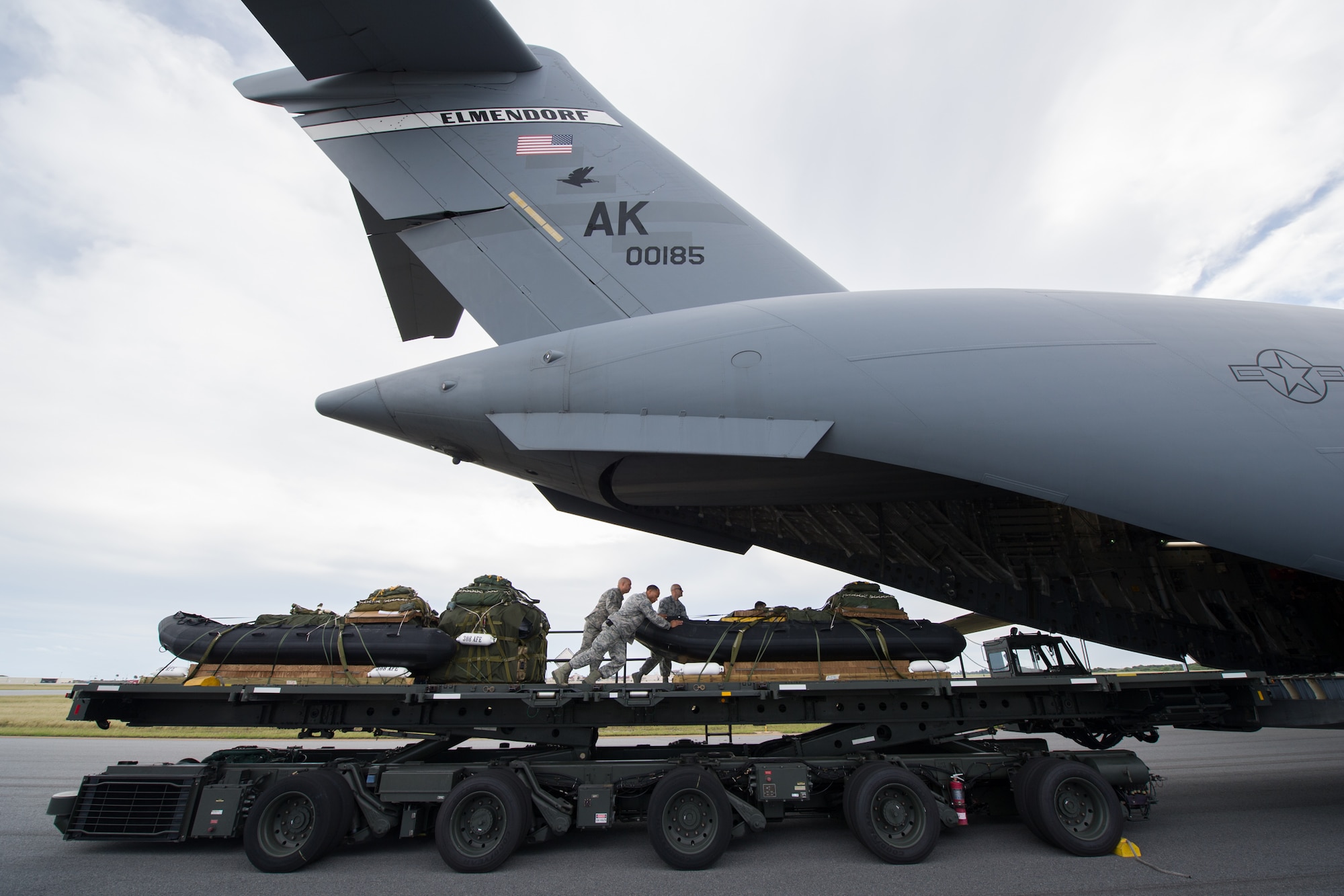 A team from the 920th Rescue Wing loads an Alaska Air National Guard C-17 Globemaster III at Patrick Air Force Base, Fla., after packaging the equipment necessary to airdrop to the designated drop zone in the Atlantic Ocean during an astronaut recovery exercise Jan. 14. Air Force Reserve Air Force pararescuemen, combat rescue officers and survival, evasion, resistance and escape specialists trained in their specialty as part of a NASA Commercial Crew Program and Air Force 45th Operations Group Detachment 3 test of capability to recover astronauts quickly and safely in the event they would need to abort their spacecraft. Det. 3, the Department of Defense's Human Space Flight Support Office, is the only full time staff that coordinates and trains personnel to support human spaceflight contingencies. Det. 3 supports all NASA human spaceflight missions, including Soyuz, Commercial Crew, and Orion, and consists of Air Force and Navy military and civilian personnel from a wide variety of specialties. (U.S Air Force photo/Ben Thacker) (Released)