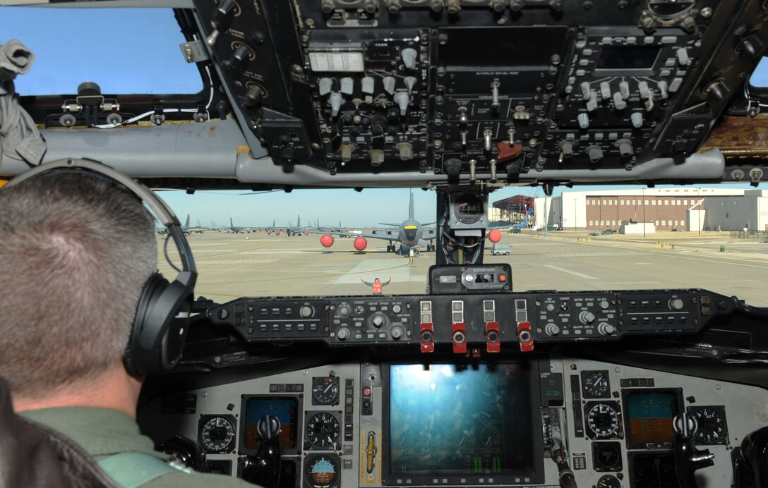 A 22nd Aircraft Maintenance Squadron crew chief marshals a KC-135 Stratotanker, Jan. 26, 2016, at McConnell Air Force Base, Kan. The aircraft was returning back to base after an aerial refueling training mission over Nebraska. (U.S. Air Force photo/Senior Airman David Bernal Del Agua)