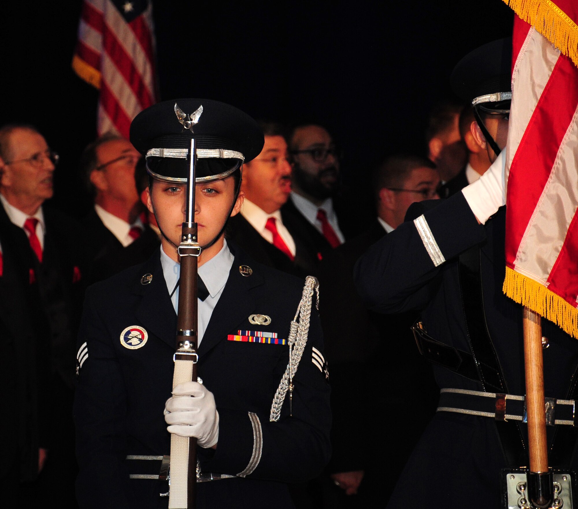 Senior Airman Tori Schultz, an honor guardsman assigned to the 6th Air Mobility Wing (AMW), presents arms as the front rifle guard during a ceremony, Oct. 2, 2015 in Tampa, Fla. The 6th AMW base honor guard performs color details and military honors at funerals for veterans in the local area. (U.S. Air Force photo by Senior Airman Jenay Randolph)    