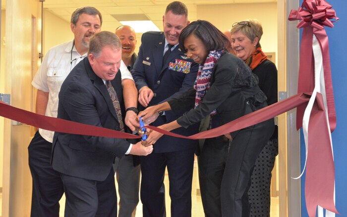 Joint Base Charleston and Palmetto Scholars Academy leaders—past and present—participated in the ribbon cutting event  opening a new school building at Hunley Park on JB Charleston, S.C., on Jan 23, 2016. The new facility has been a five year project headed by Stacey Lindbergh, PSA chairman of the board, which began with discussions with former JB Charleston commander Col. Richard McComb. (U.S. Air Force photo/Airman 1st Class Thomas T. Charlton)