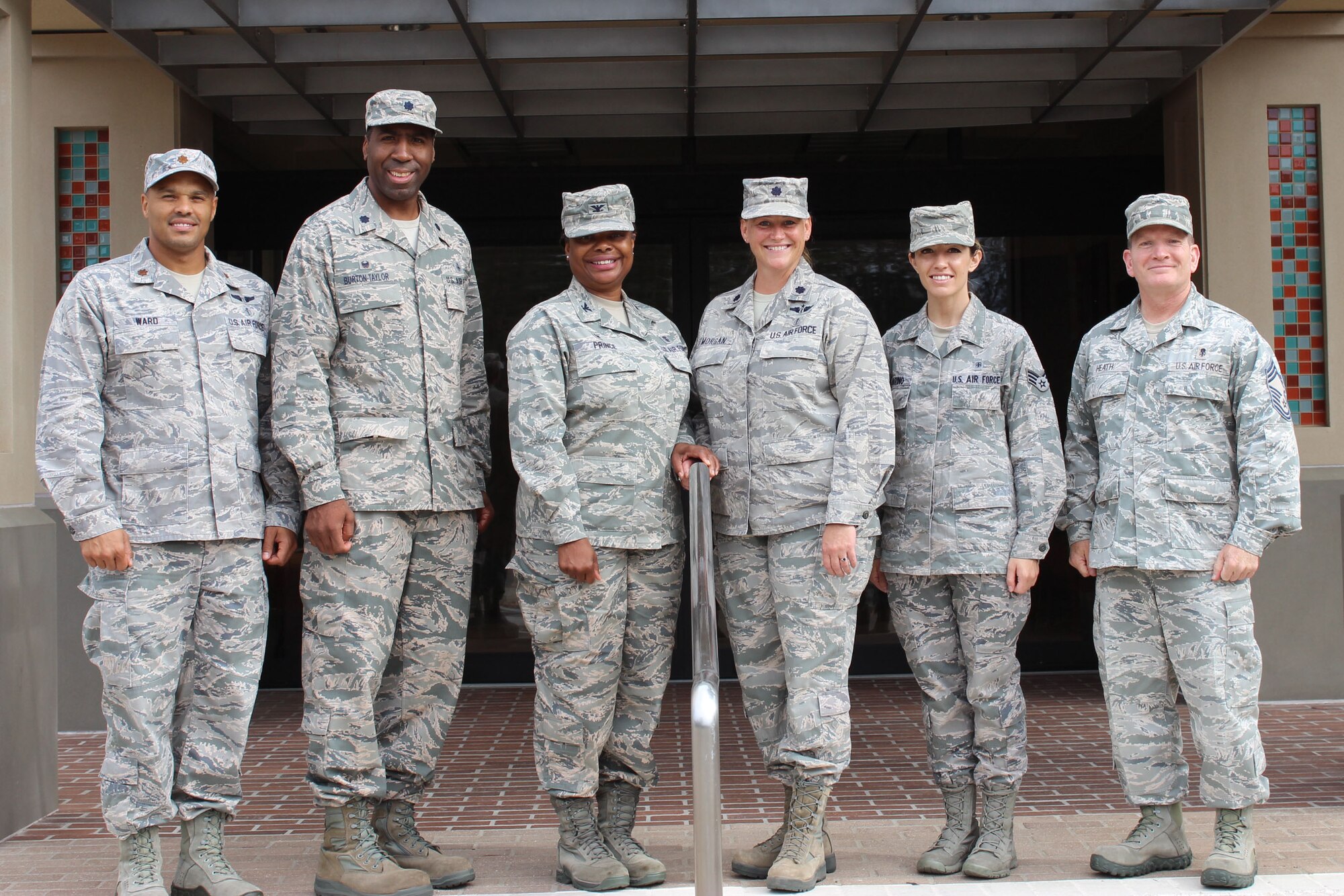 Leaders from the 9th Space Operations Squadron and 30th Medical Squadron, respectively, pose for a photo in front of the 30th MDG building, Sept. 12, 2015, Vandenberg Air Force Base, Calif. In the spirit of partnership and Total Force teamwork, the 9 SOPS and the 30th MDG collaborated to utilize the clinic facility during Unit Training Assembly, also known as drill weekend, for local Reservists. (Courtesy photo)