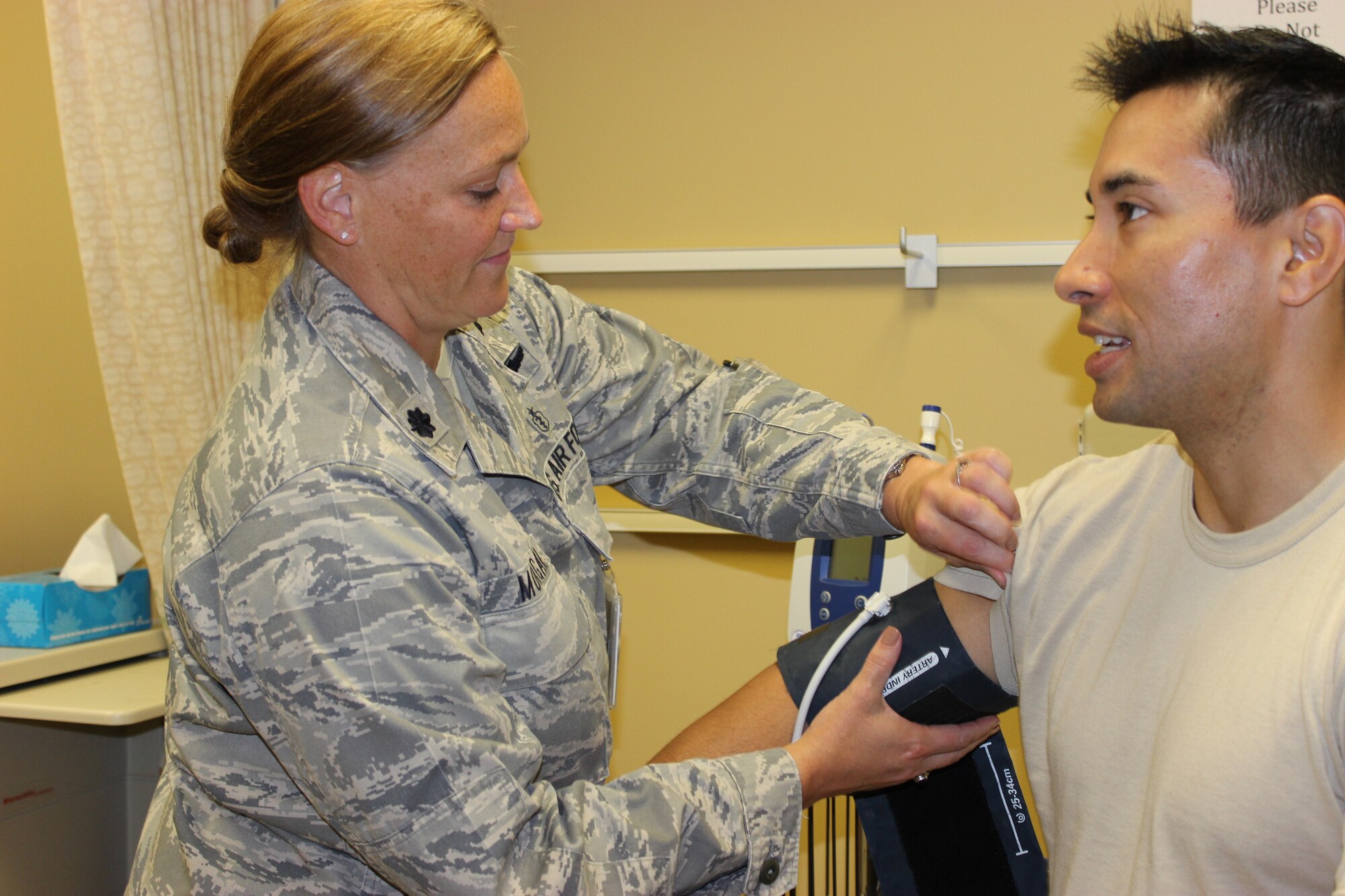 Lt. Col. Charla Morgan, 30th Medical Group flight surgeon takes Maj. Ramon Rodriguez’s blood pressure, Sept. 12, 2015, Vandenberg Air Force Base, Calif. In the spirit of partnership and Total Force teamwork, the 9 SOPS and the 30th MDG collaborated to utilize the clinic facility during Unit Training Assembly, also known as drill weekend, for local Reservists. (Courtesy photo)