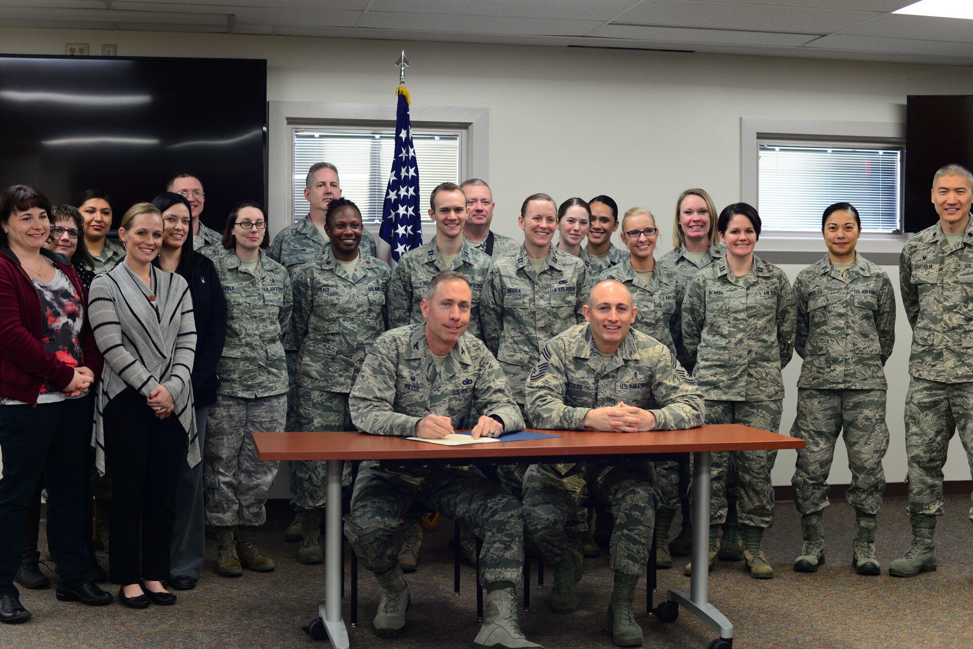 The Biomedical Sciences Corps Appreciation Week Proclamation for the 341st Medical Group is signed by John Wilcox, the 341st Missile Wing commander, Jan. 25, 2016, at Malmstrom Air Force Base, Mont. The appreciation week took place Jan. 25-29, 2016, and honored the dedication, commitment and efforts of Biomedical Sciences Corps Airmen in the Air Force. Before signing the proclamation, Wilcox addressed the medical professionals in attendance and thanked them for the work they do to support the nuclear deterrence mission. (U.S. Air Force photo/Airman 1st Class Magen M. Reeves)