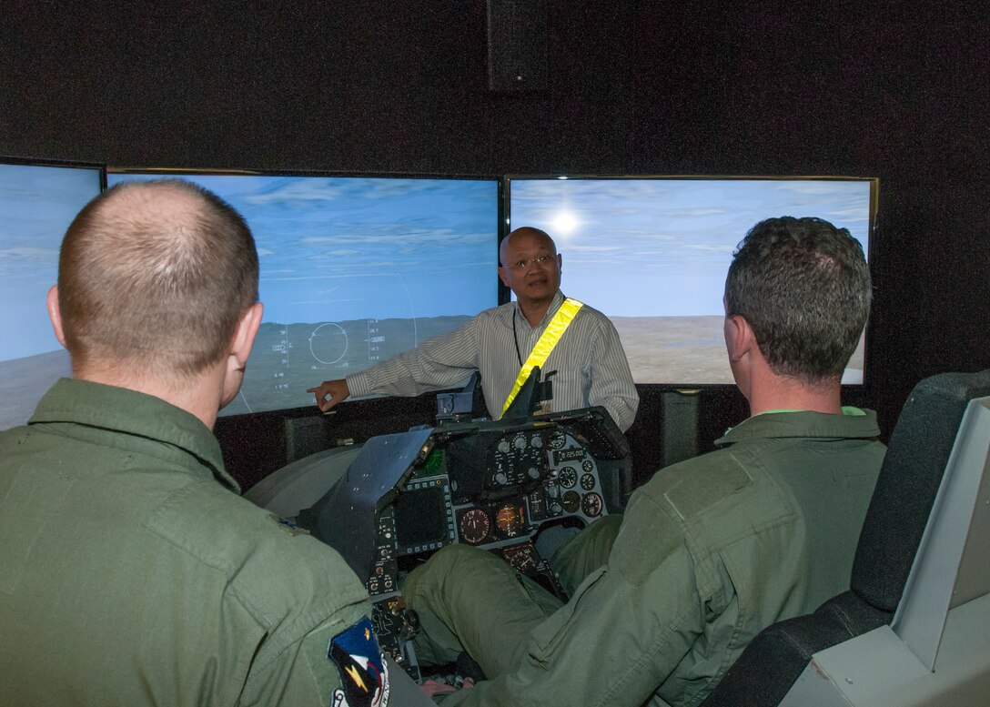 Tour attendees got the chance to try out simulators in the Integration Facility for Flight Avionics Systems Test (IFAST) during an honorary commanders tour Jan. 22. (U.S. Air Force photo by John Perry)