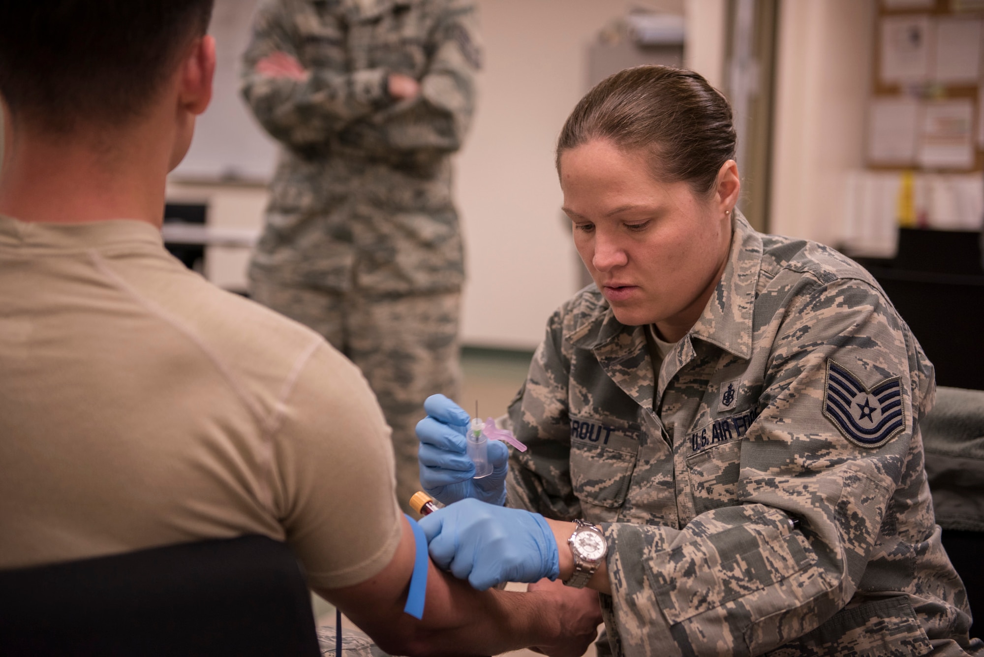 JOINT BASE ELMENDORF-RICHARDSON, Alaska -- Tech. Sgt. Jennifer Trout, an independent duty medical technician with the 176th Medical Group, draws blood for thirteen Alaska Air Guard defenders here Jan. 25, 2016. The group from the 176th Security Forces Squadron began in-processing after a six-month deployment to Kuwait in support of Operation Enduring Freedom. (U.S. Air National Guard photo by Tech. Sgt. N. Alicia Halla/ Released)