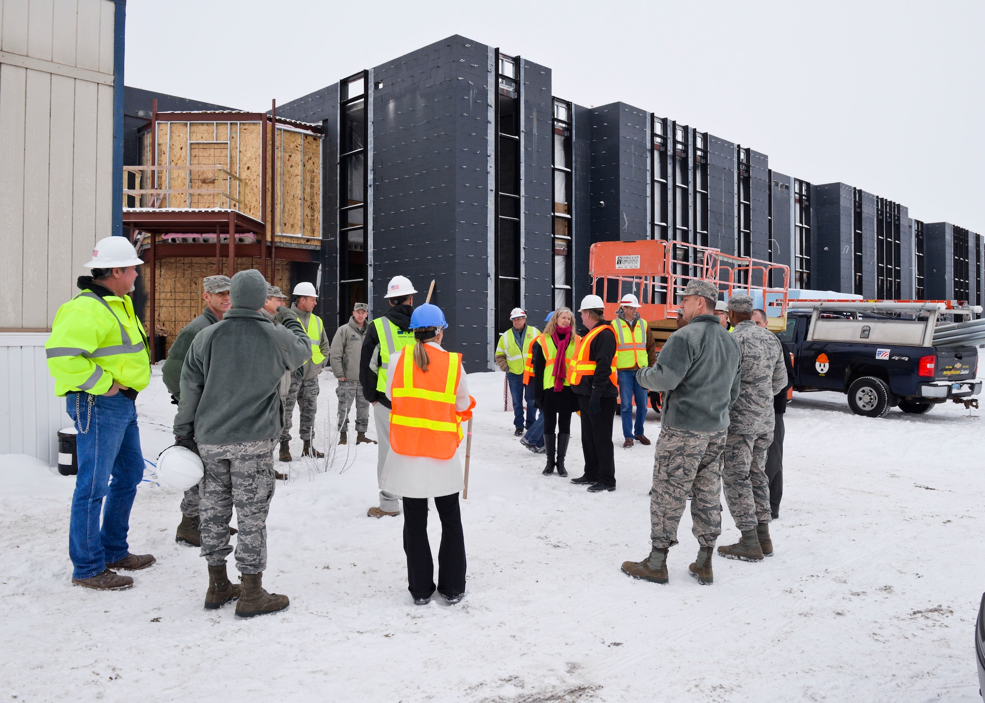 Base leadership tours the new temporary lodging facility site, currently under construction at Minot Air Force Base, N.D., Jan. 20, 2016.  The new facility will double the lodging capacity for Airmen and their families transitioning onto and off the base. (U.S. Air Force photos/Airman 1st Class J.T. Armstrong)


